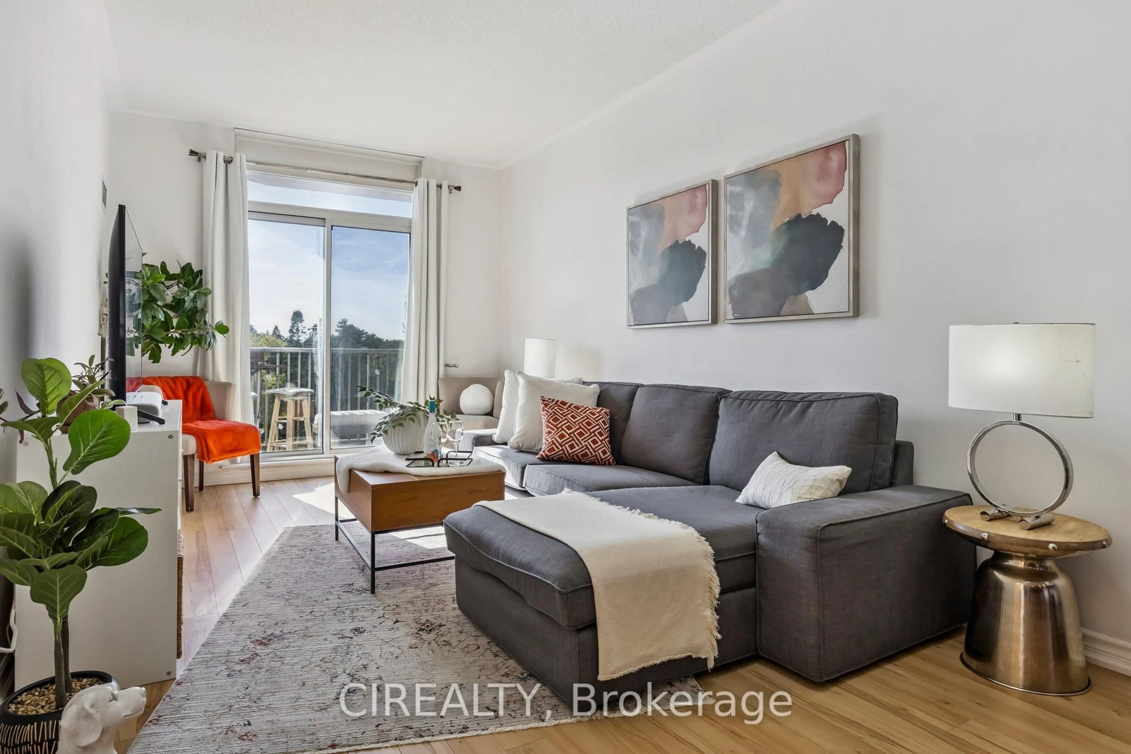 Living room with furniture, wood/laminate floor for 4200 Bathurst St #413, Toronto Ontario M3H 6C7