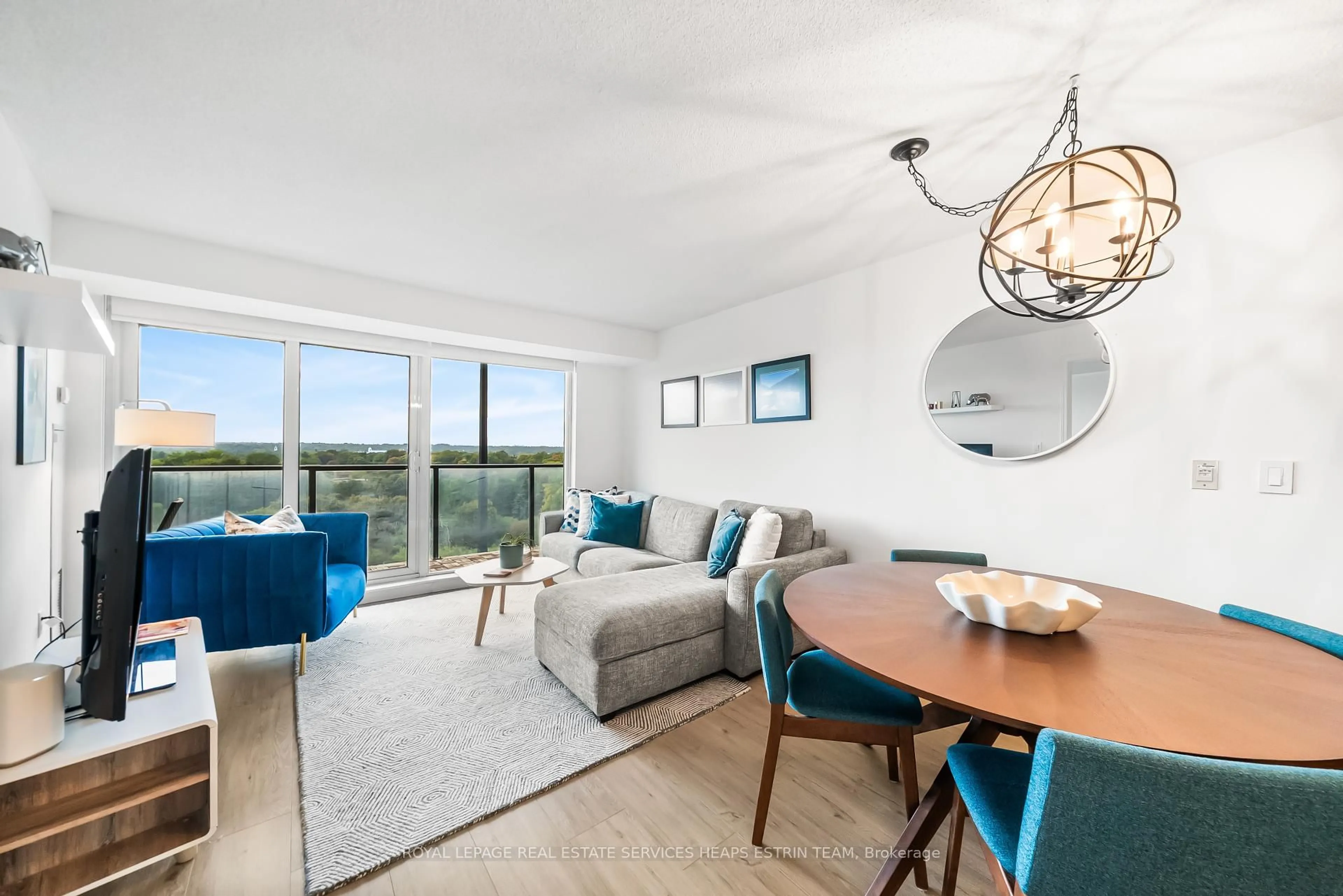 Living room with furniture, wood/laminate floor for 18 Valley Woods Rd #806, Toronto Ontario M3A 0A1