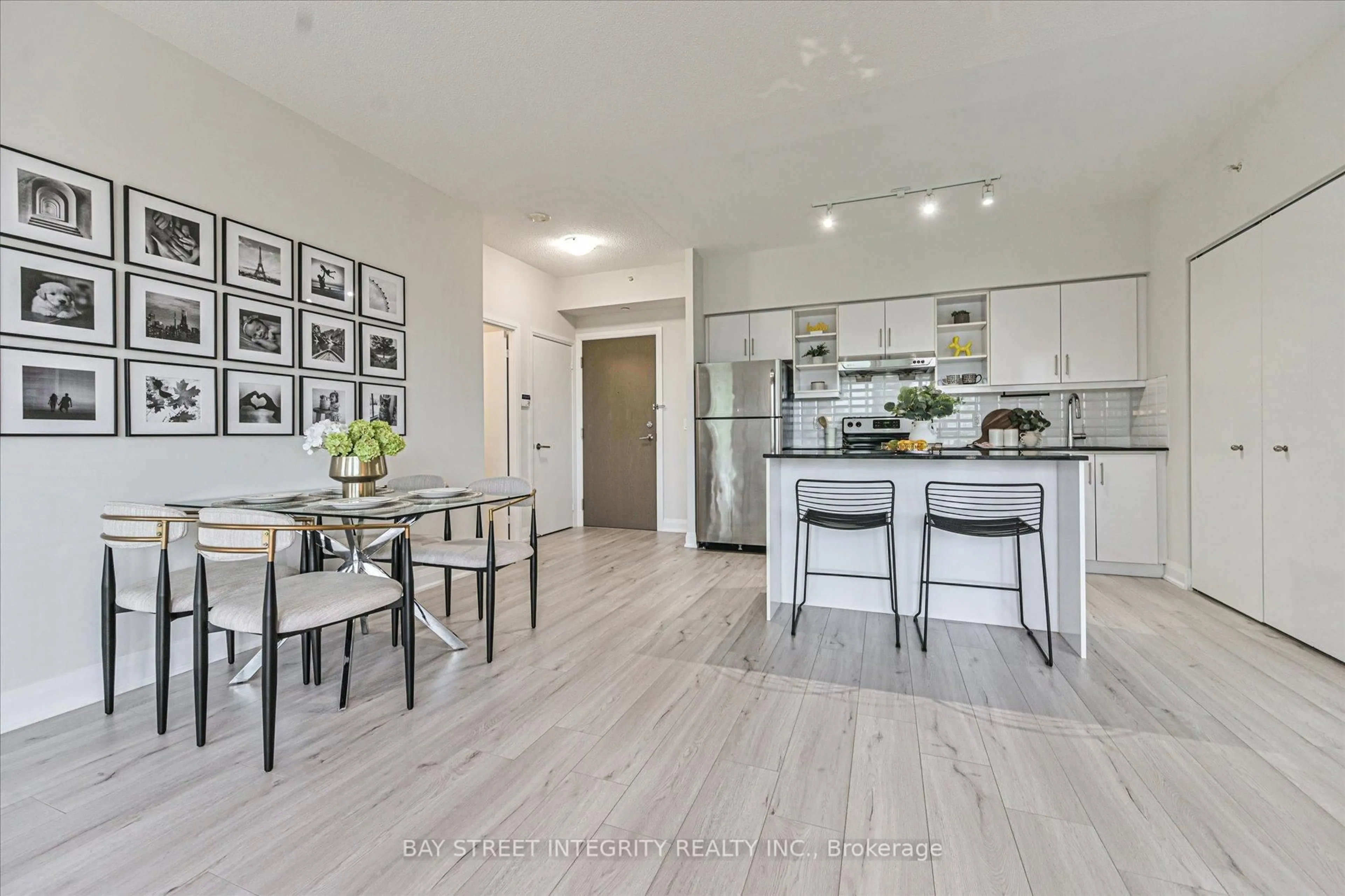 Open concept kitchen, wood/laminate floor for 160 Vanderhoof Ave #415, Toronto Ontario M4G 0B7