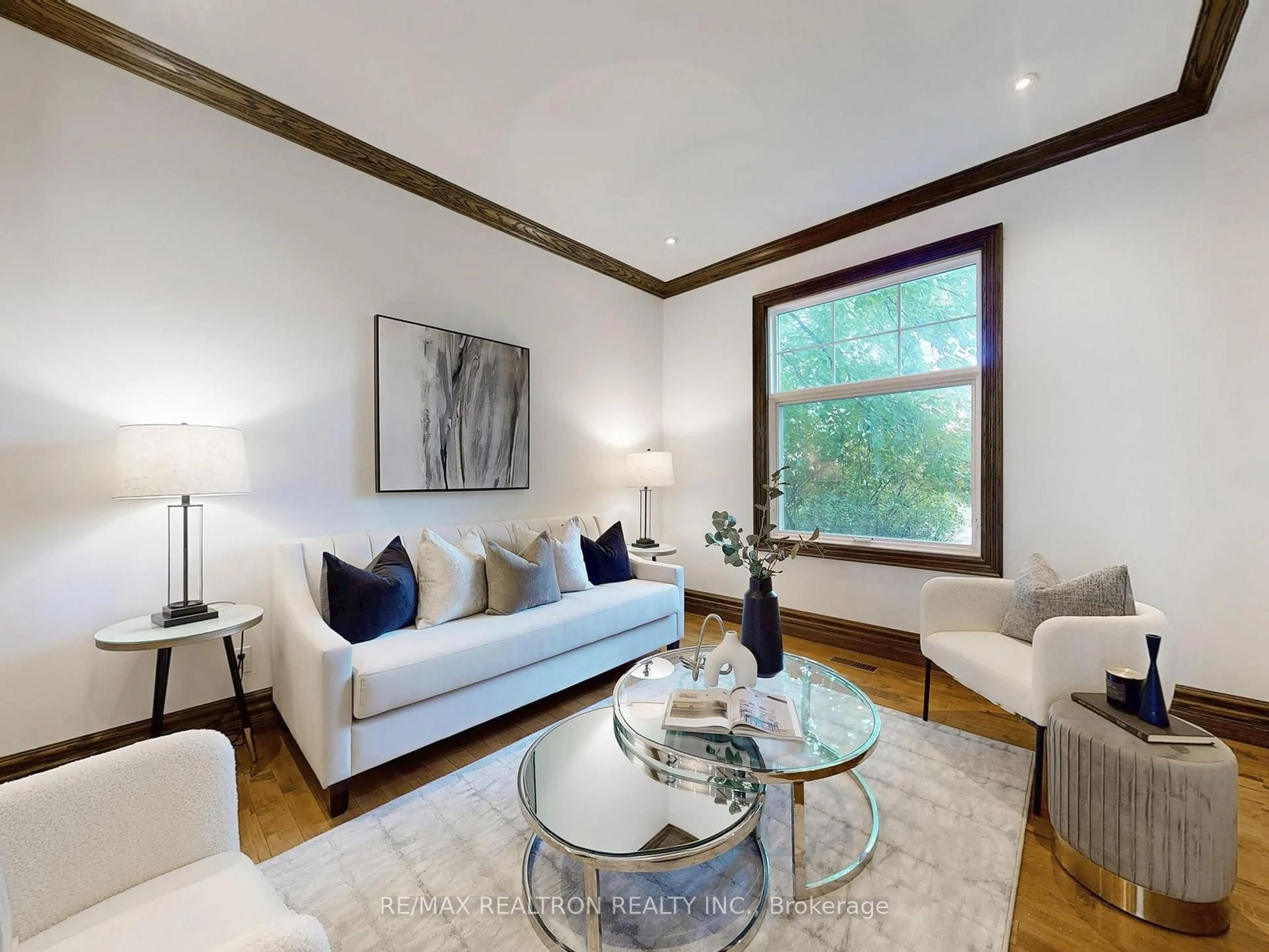 Living room with furniture, wood/laminate floor for 10 Lindsey Ave, Toronto Ontario M6H 1C9