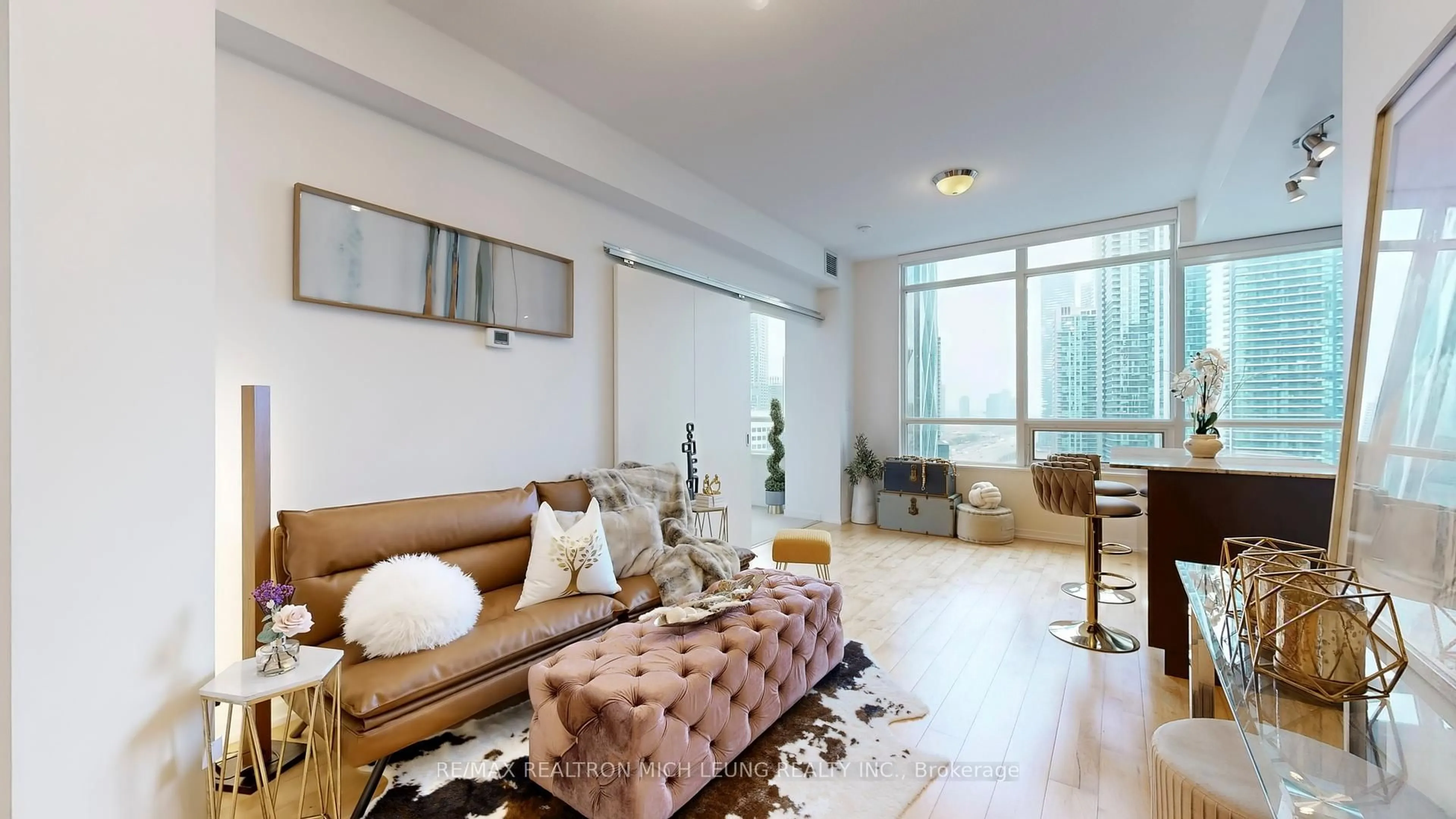 Living room with furniture, unknown for 55 Bremner Blvd #1704, Toronto Ontario M5J 0A6