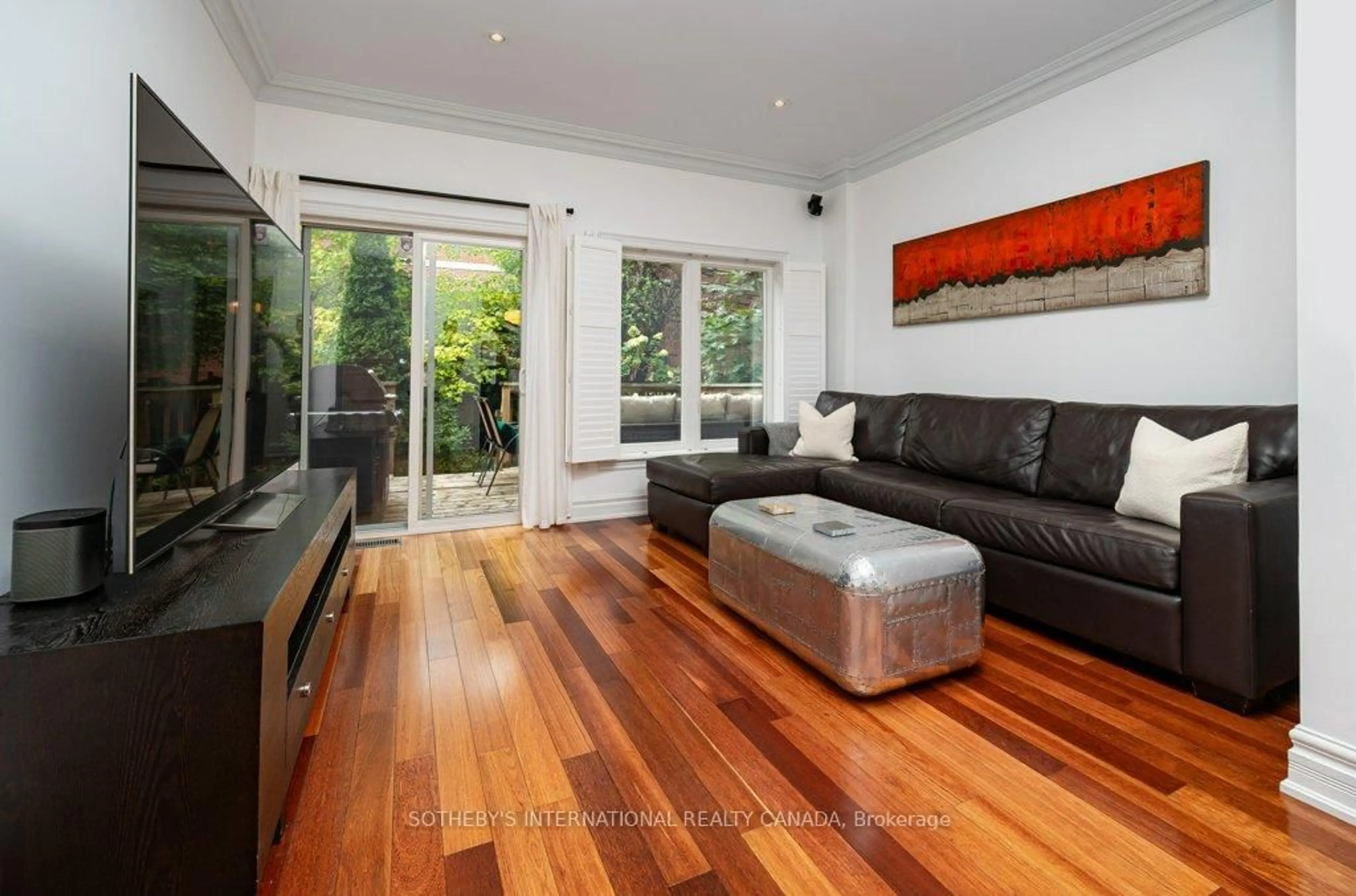 Living room with furniture, wood/laminate floor for 463 Shuter St, Toronto Ontario M5A 1X4
