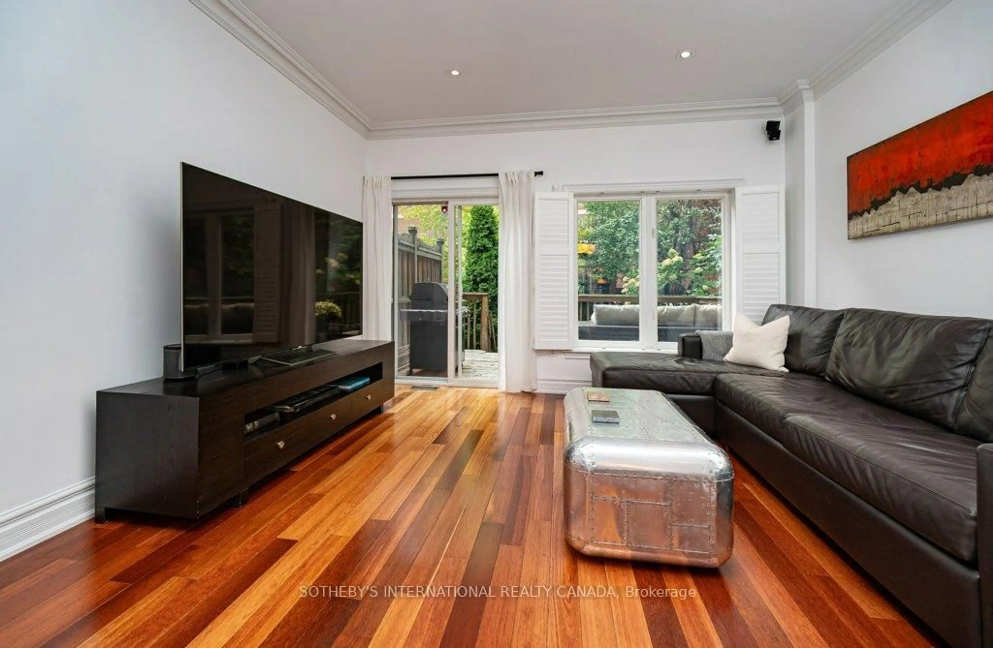 Living room with furniture, wood/laminate floor for 463 Shuter St, Toronto Ontario M5A 1X4