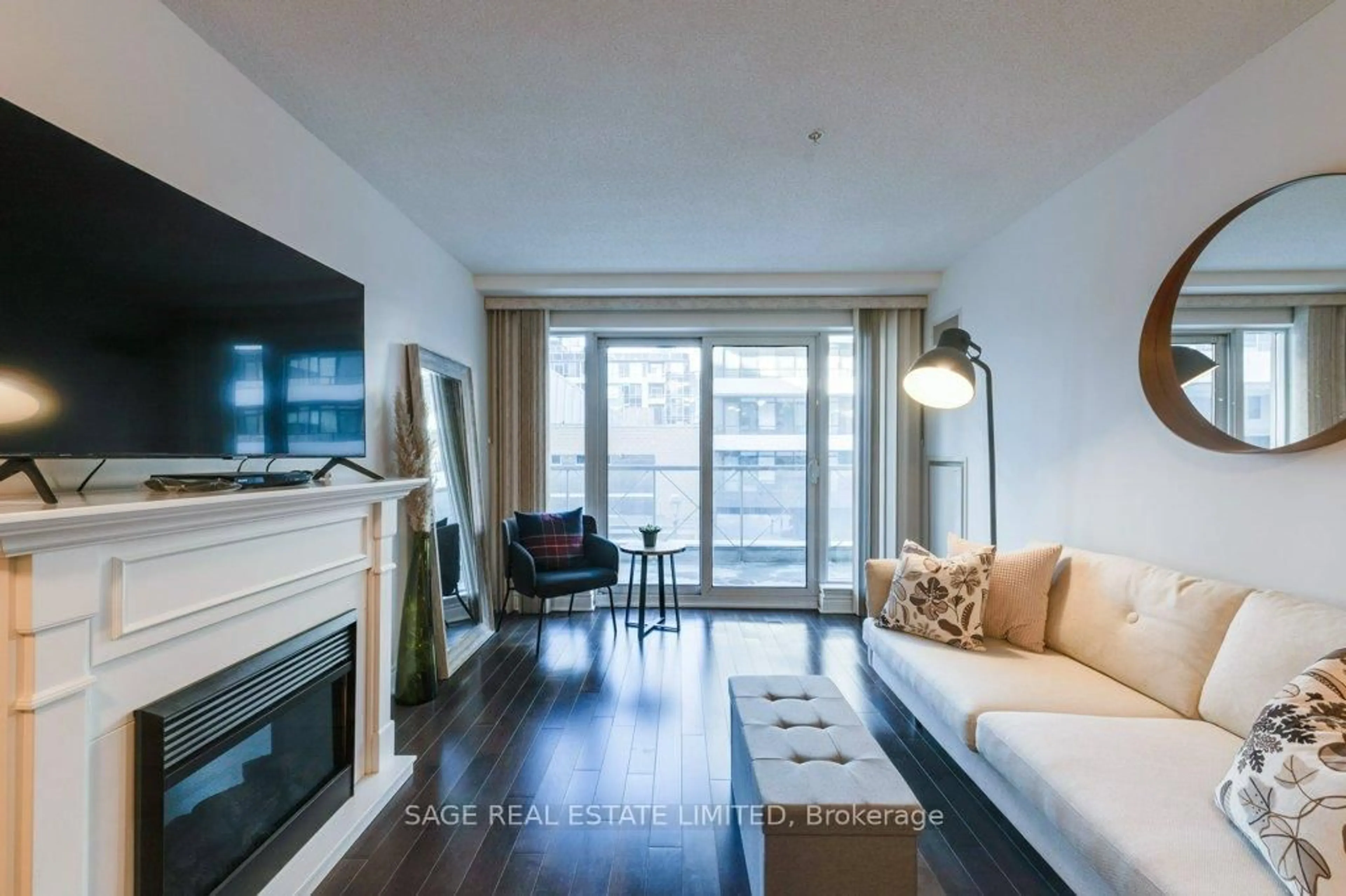Living room with furniture, wood/laminate floor for 12 Rean Dr #307, Toronto Ontario M2K 3C6