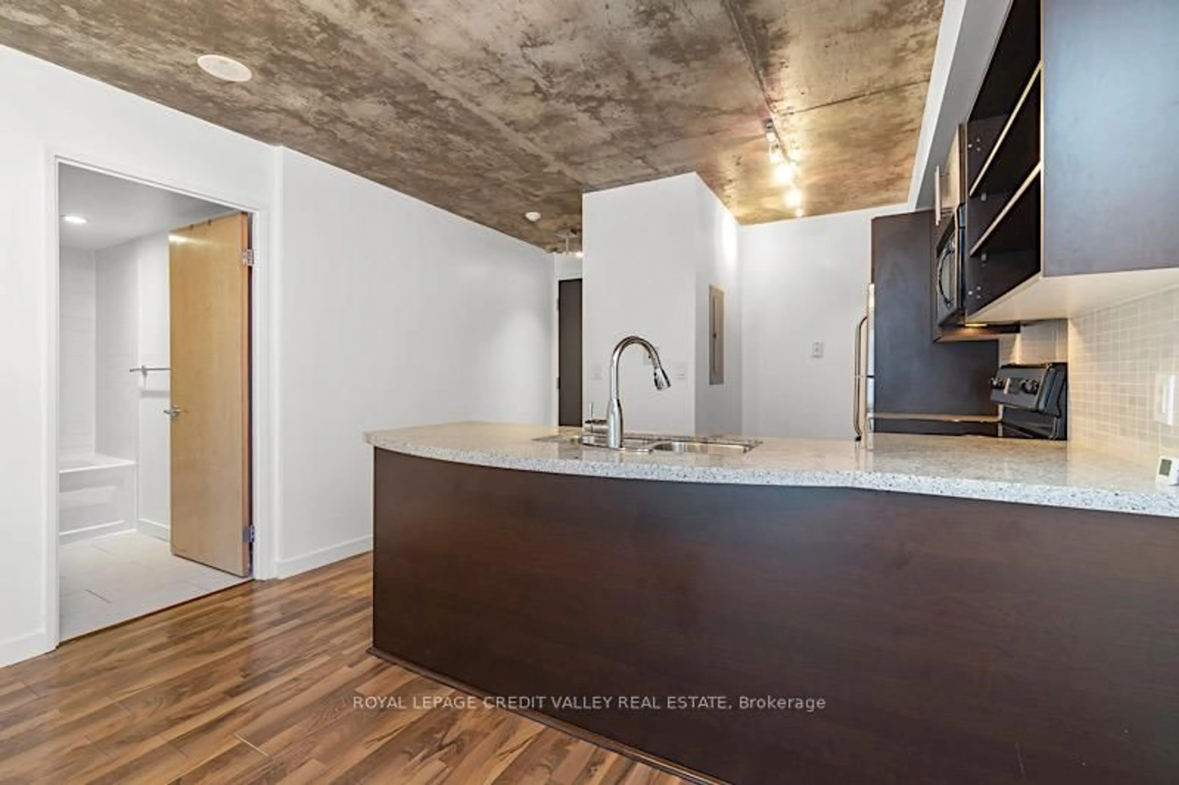Open concept kitchen, cement floor for 1005 King St #505, Toronto Ontario M6K 3M8