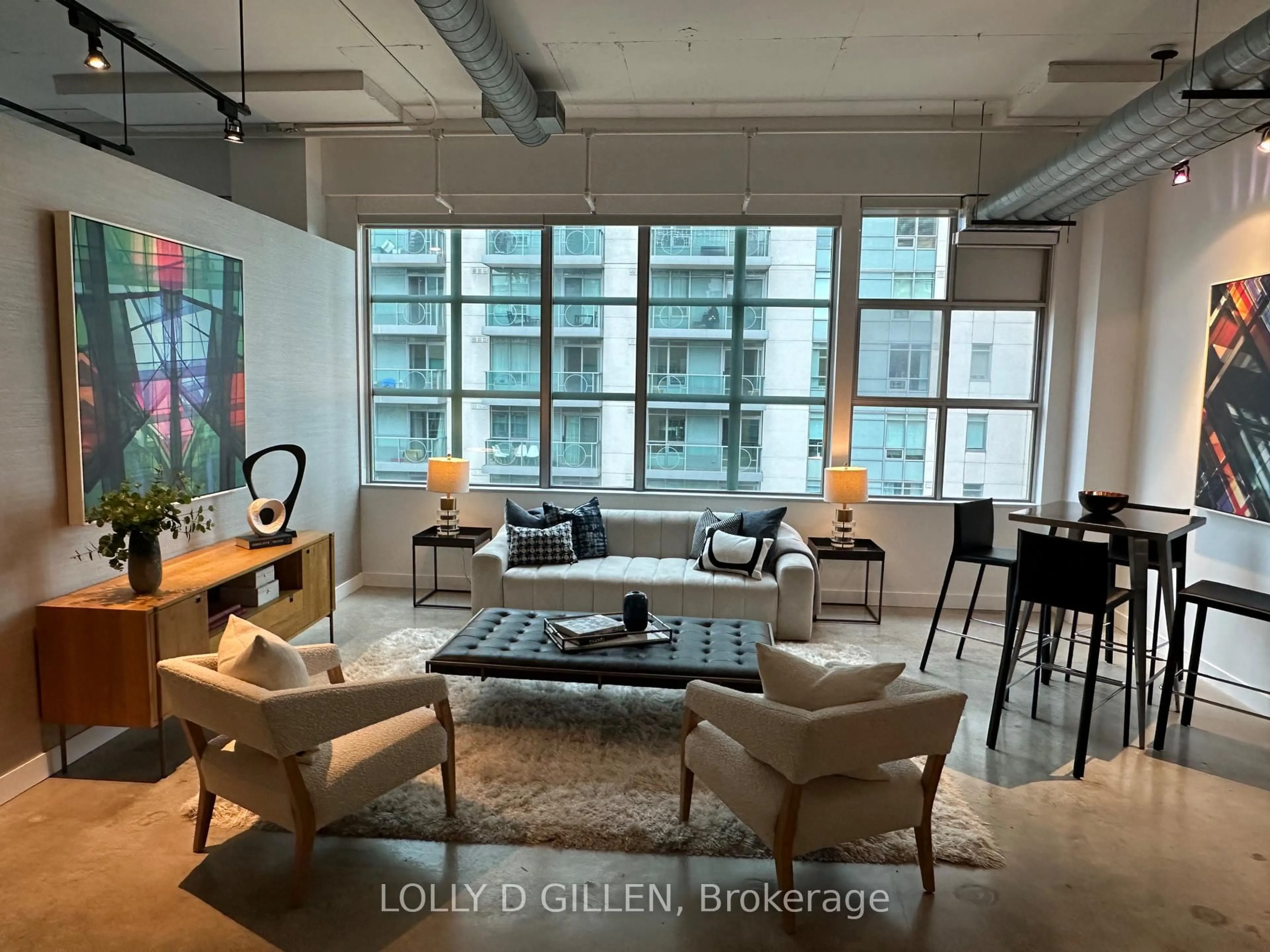 Living room with furniture, cement floor for 188 Eglinton Ave #PH08, Toronto Ontario M4P 2X7