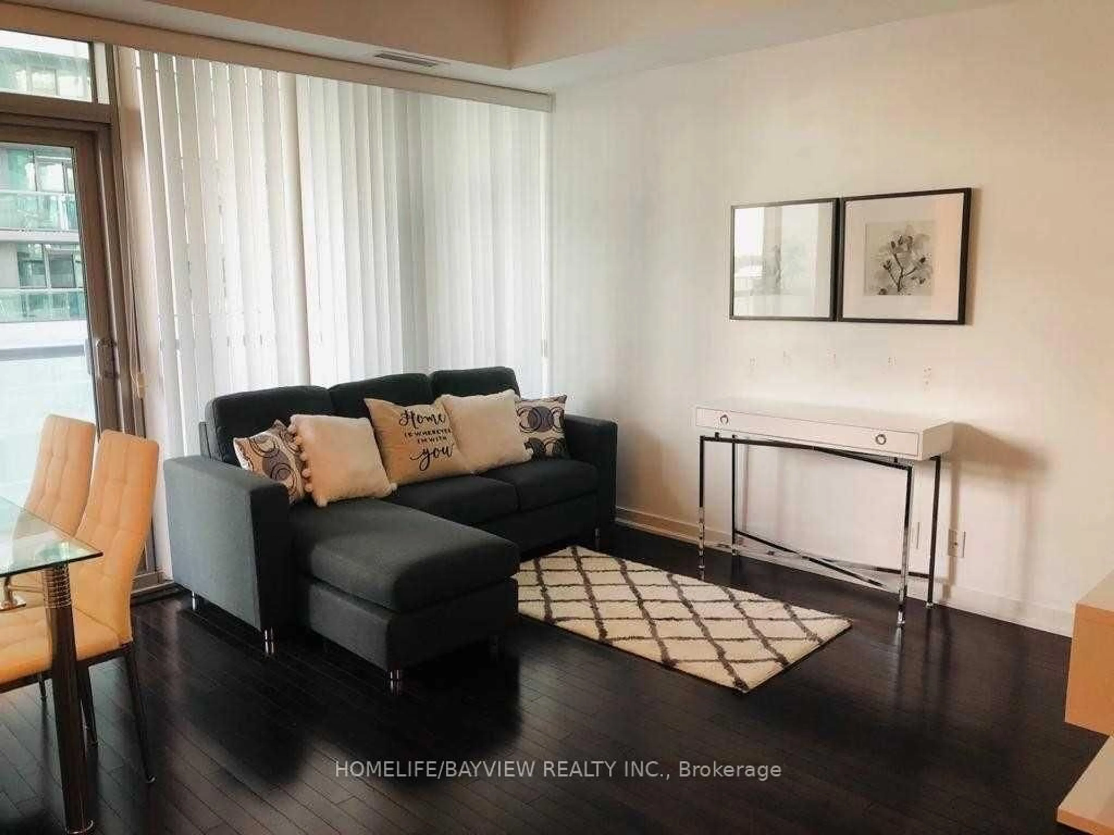 Living room with furniture, wood/laminate floor for 12 York St #1605, Toronto Ontario M5J 2Z2