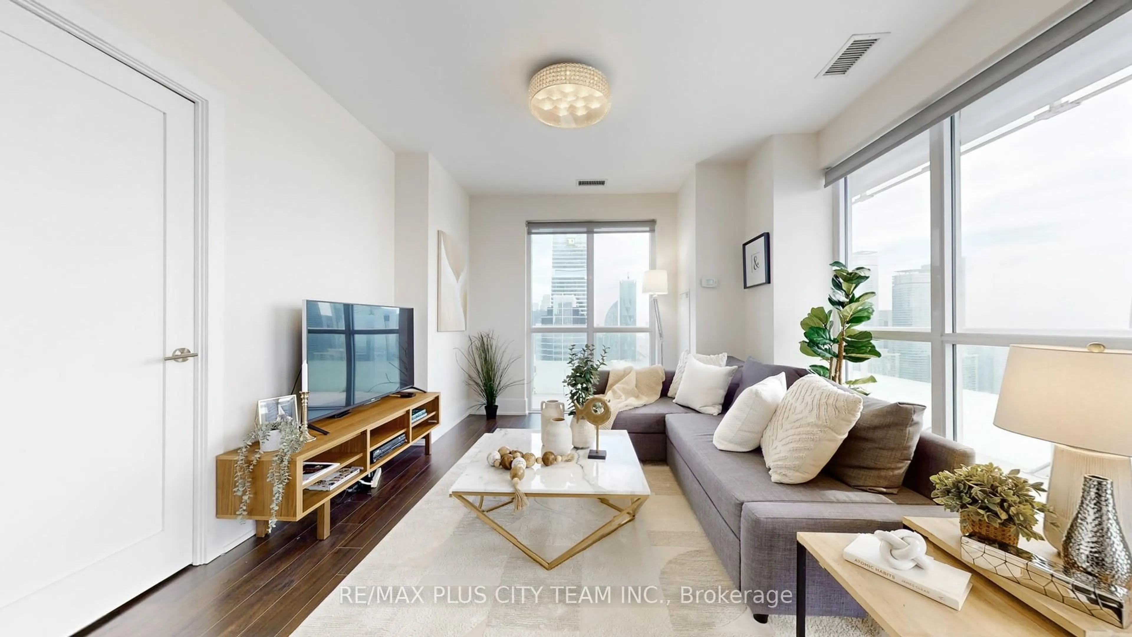 Living room with furniture, wood/laminate floor for 300 Front St #4311, Toronto Ontario M5V 0E9