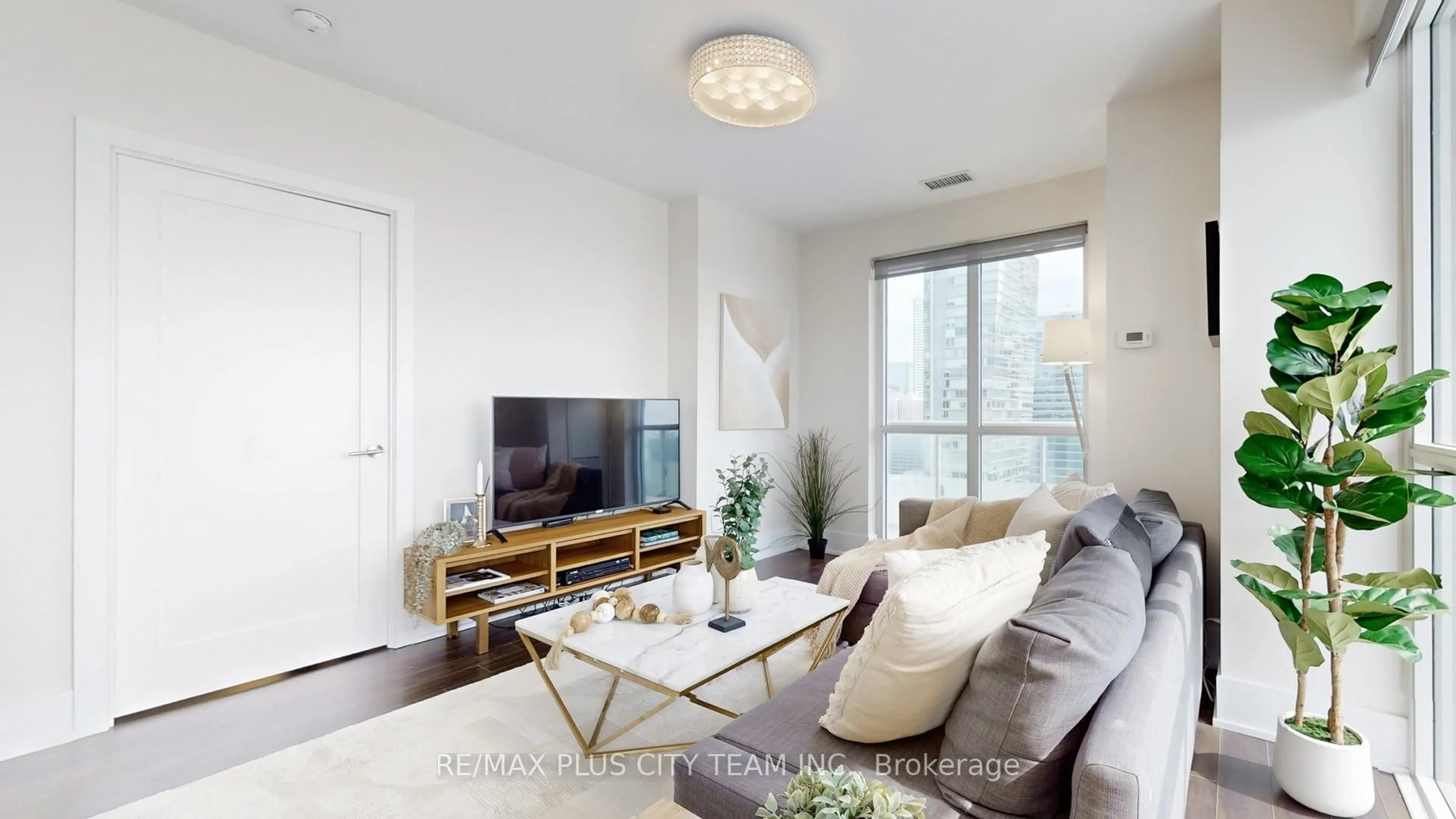 Living room with furniture, wood/laminate floor for 300 Front St #4311, Toronto Ontario M5V 0E9