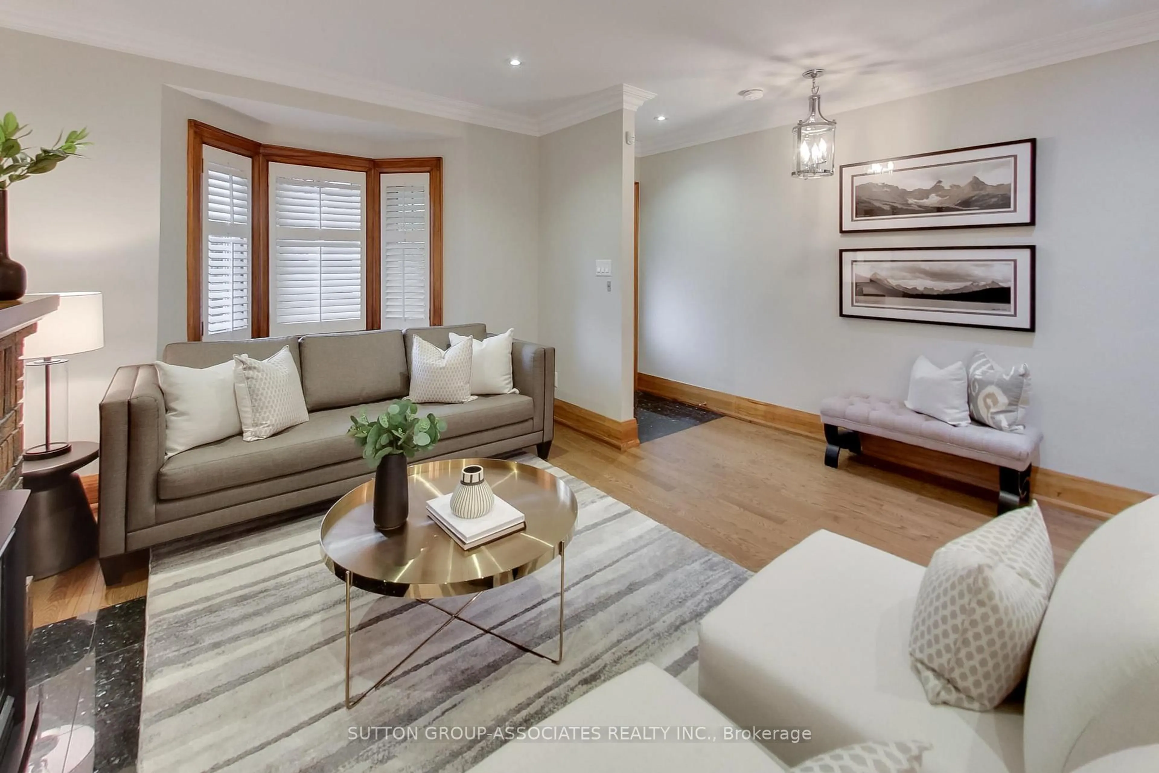 Living room with furniture, wood/laminate floor for 163 Maplewood Ave, Toronto Ontario M6C 1J8