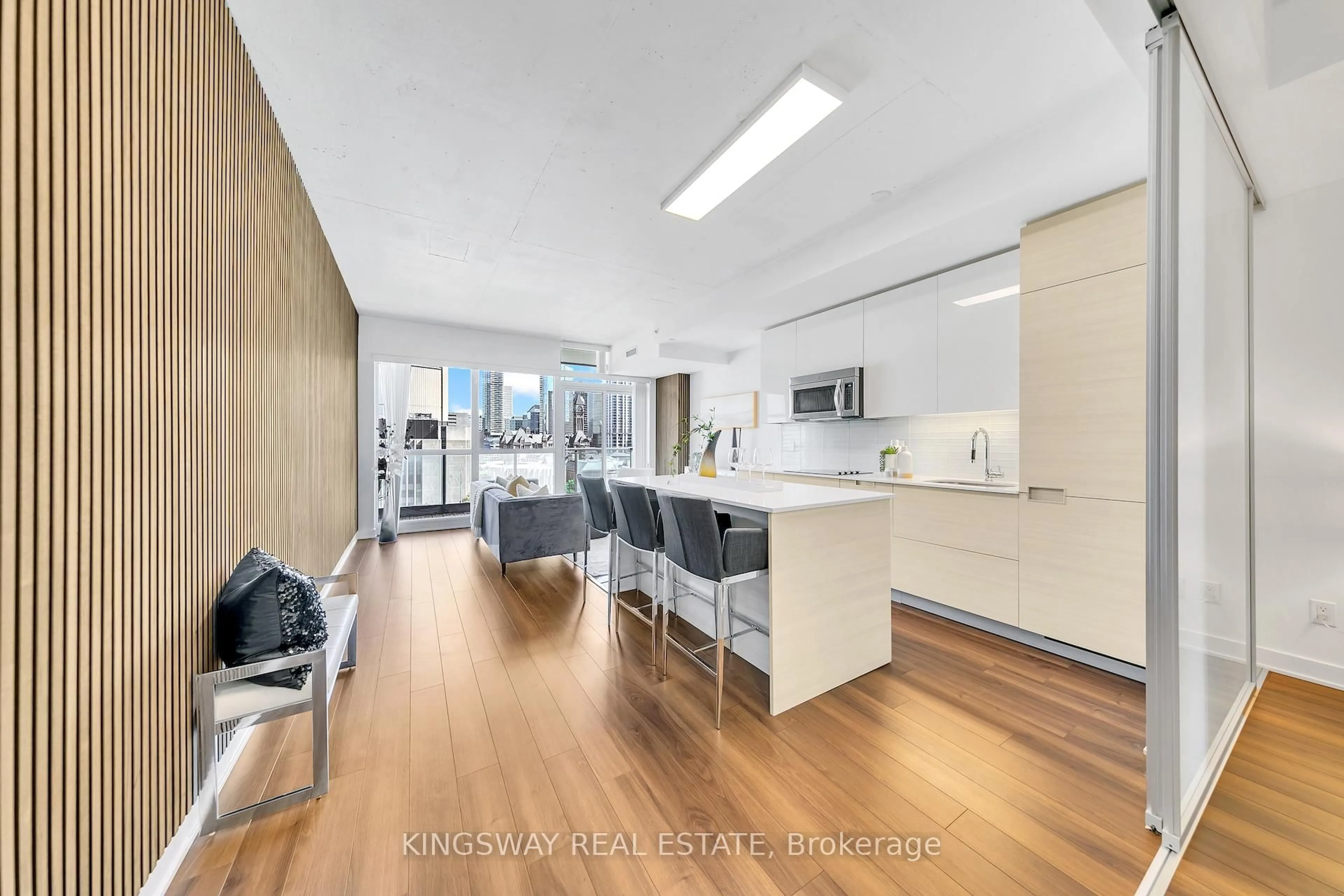 Open concept kitchen, wood/laminate floor for 210 Simcoe St #911, Toronto Ontario M5T 0A9