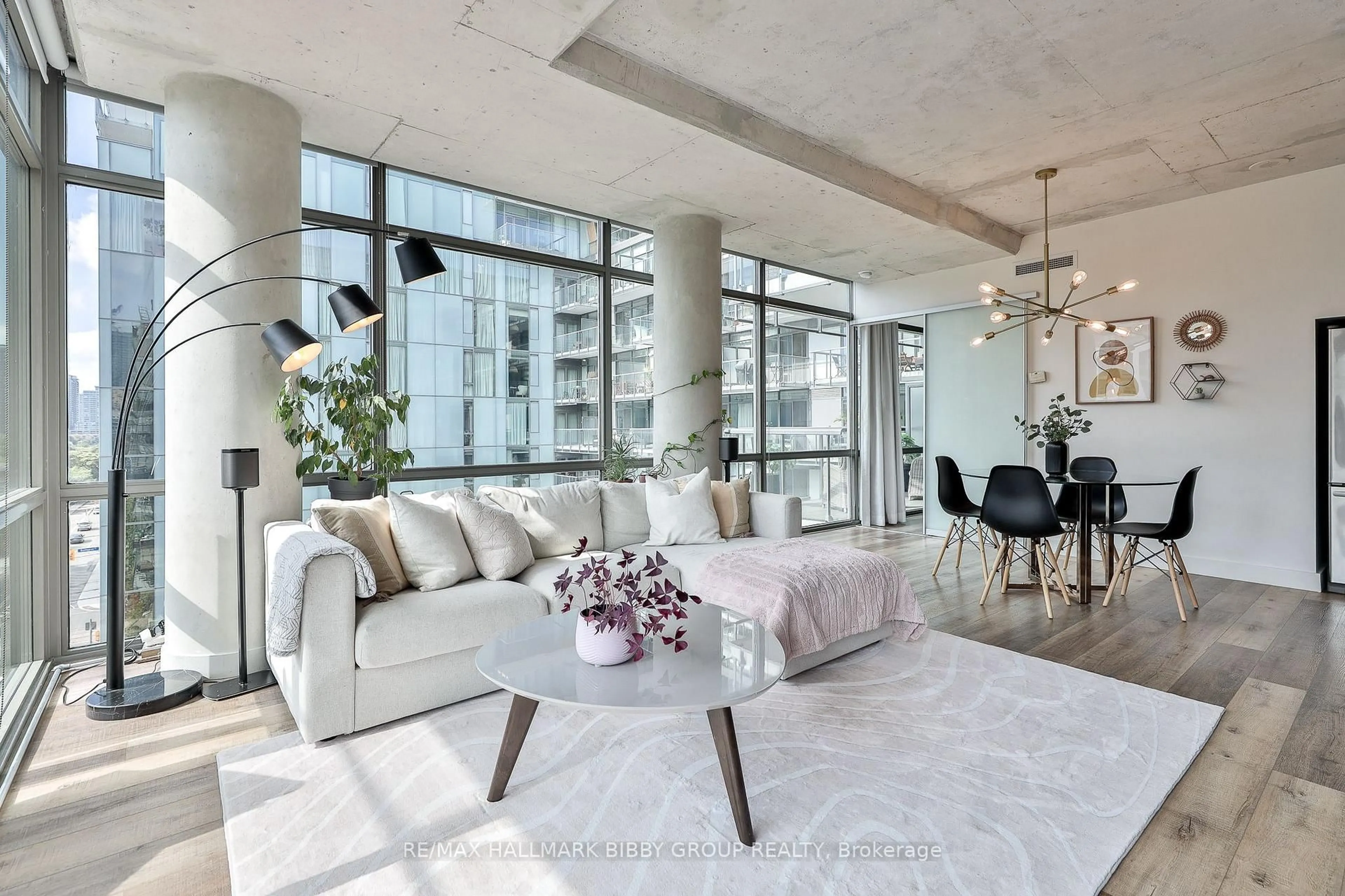 Living room with furniture, cement floor for 55 Stewart St #731, Toronto Ontario M5V 2V1