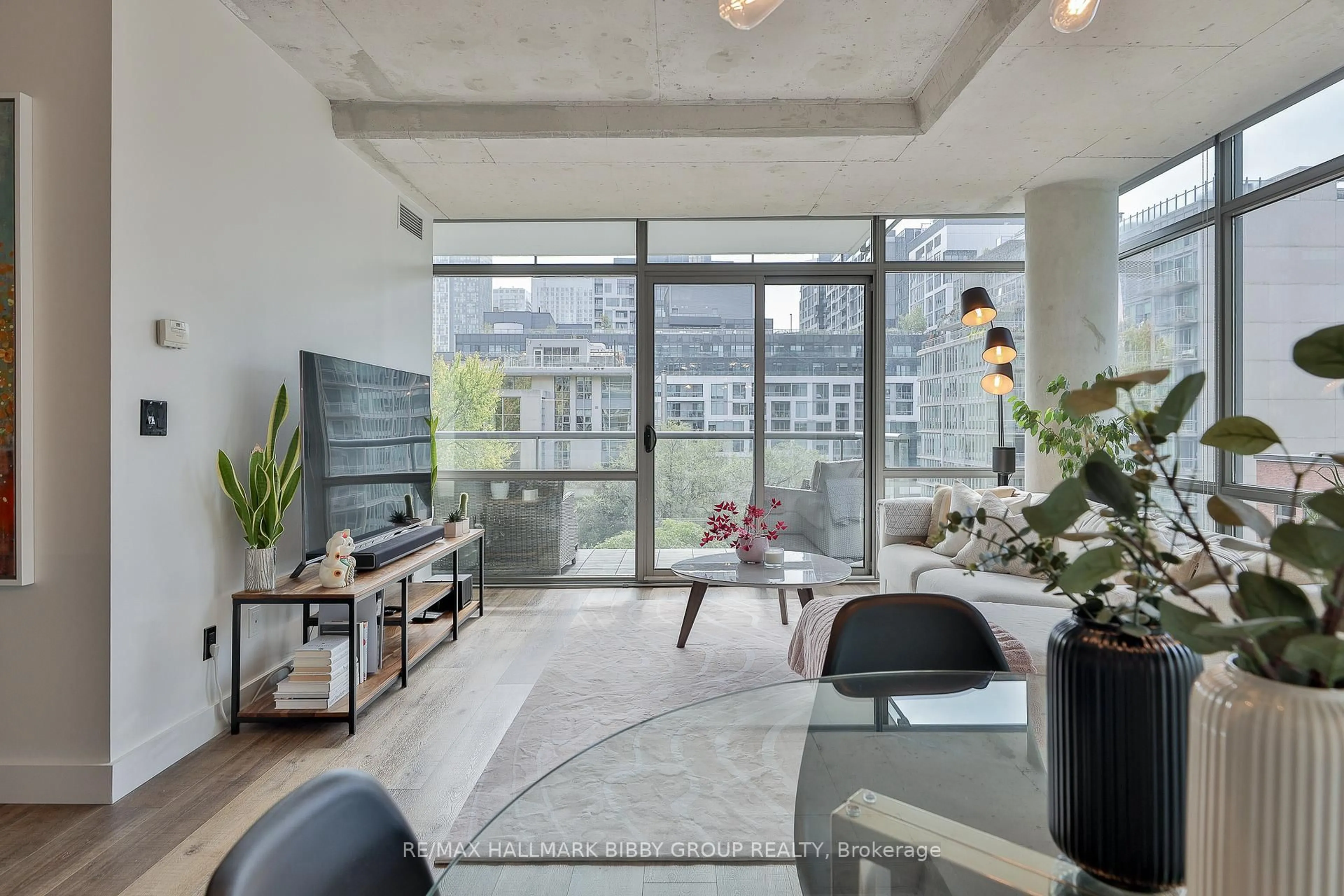 Living room with furniture, cement floor for 55 Stewart St #731, Toronto Ontario M5V 2V1