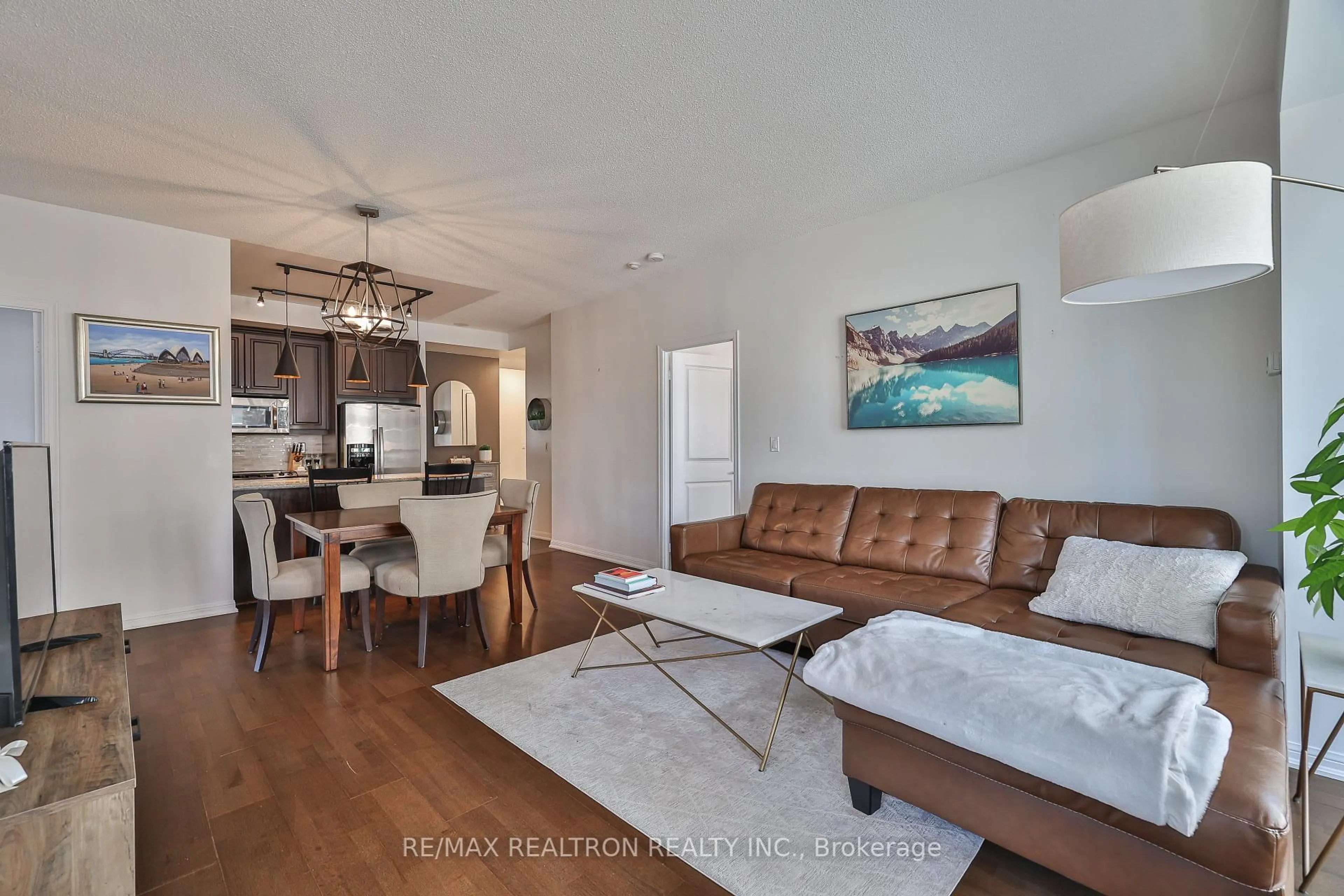 Living room with furniture, wood/laminate floor for 628 fleet St #407, Toronto Ontario M5V 1A8