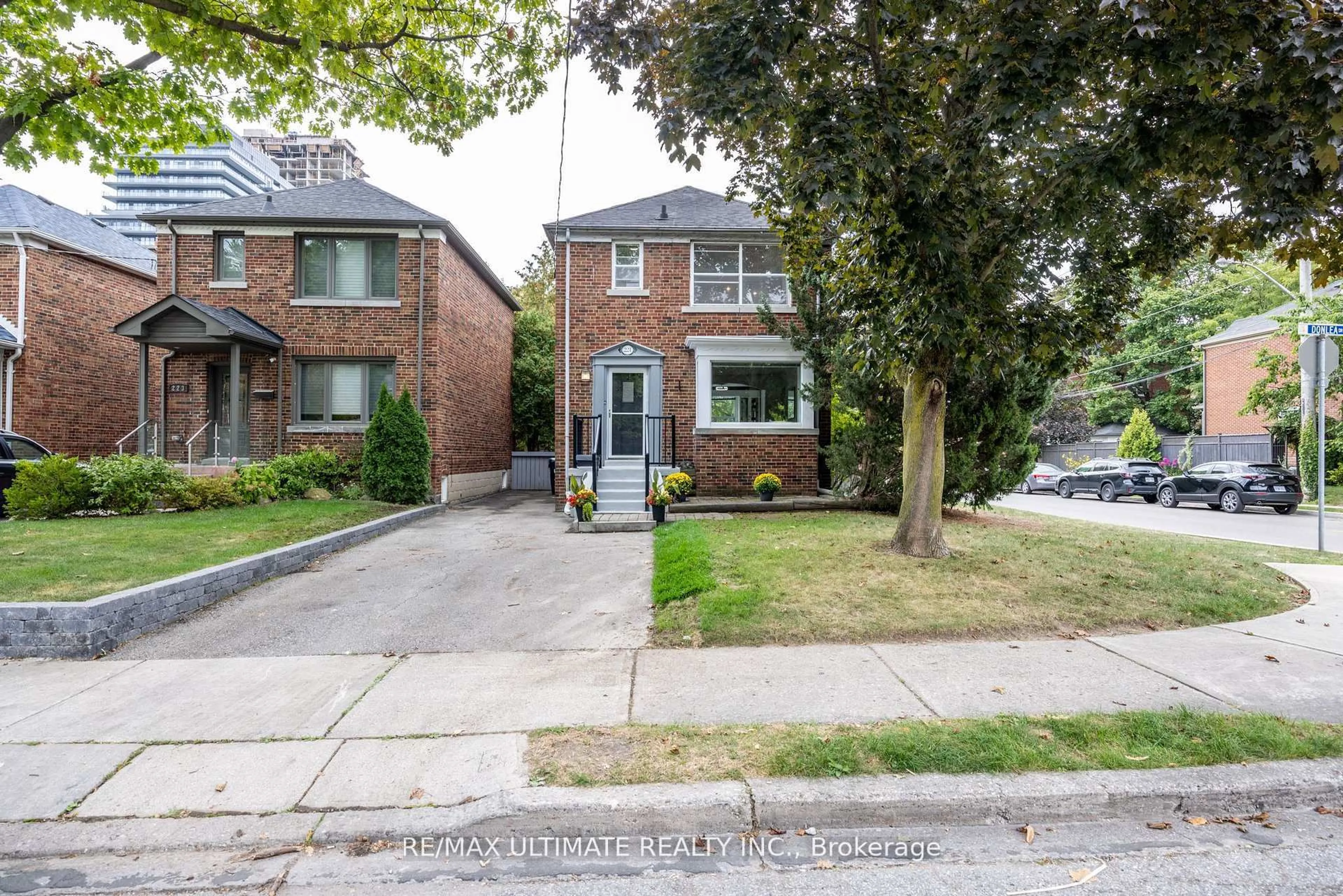 Home with brick exterior material, street for 221 Donlea Dr, Toronto Ontario M4G 2N3