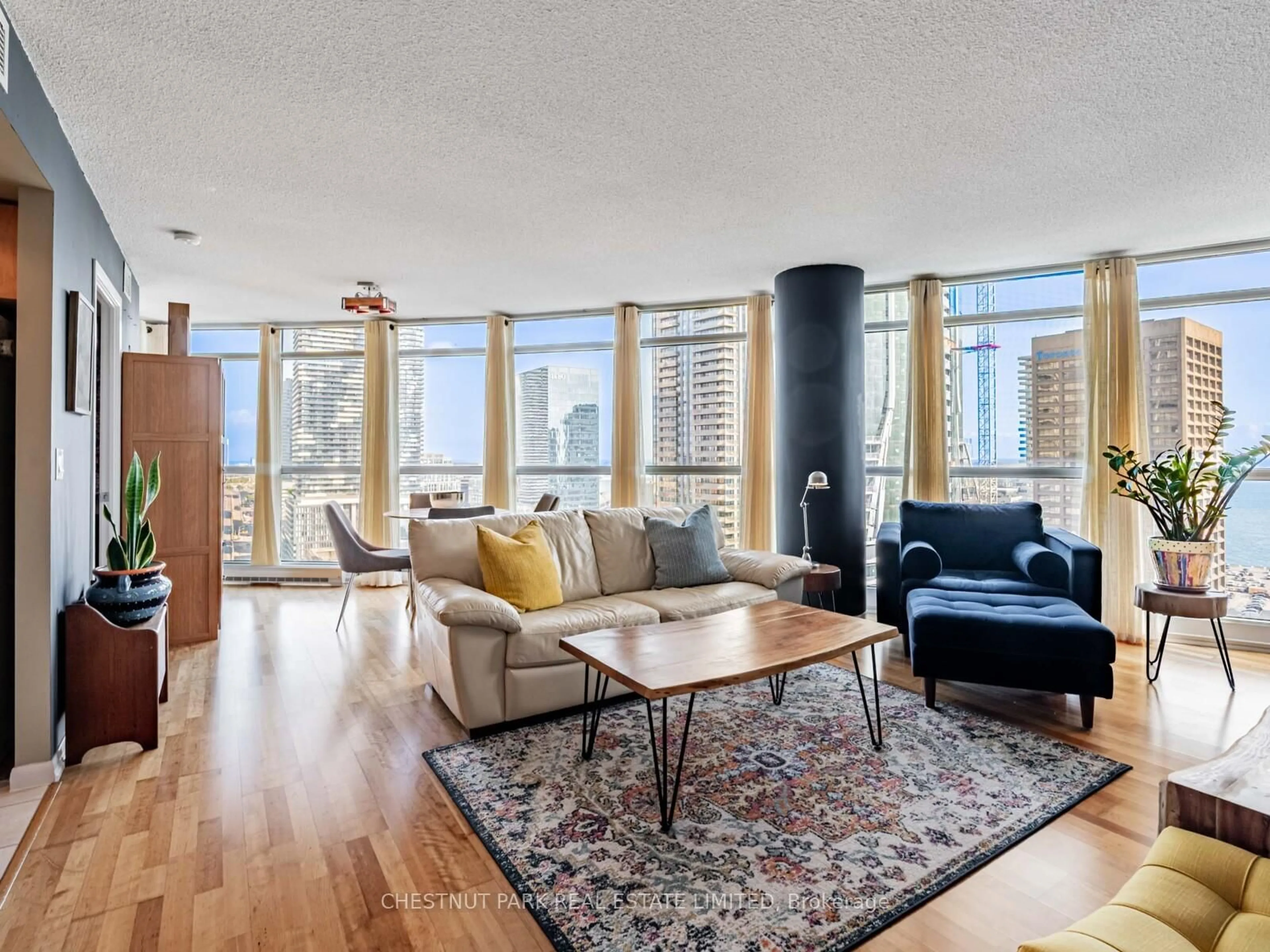 Living room with furniture, wood/laminate floor for 18 Yonge St, Toronto Ontario M5E 1Z8