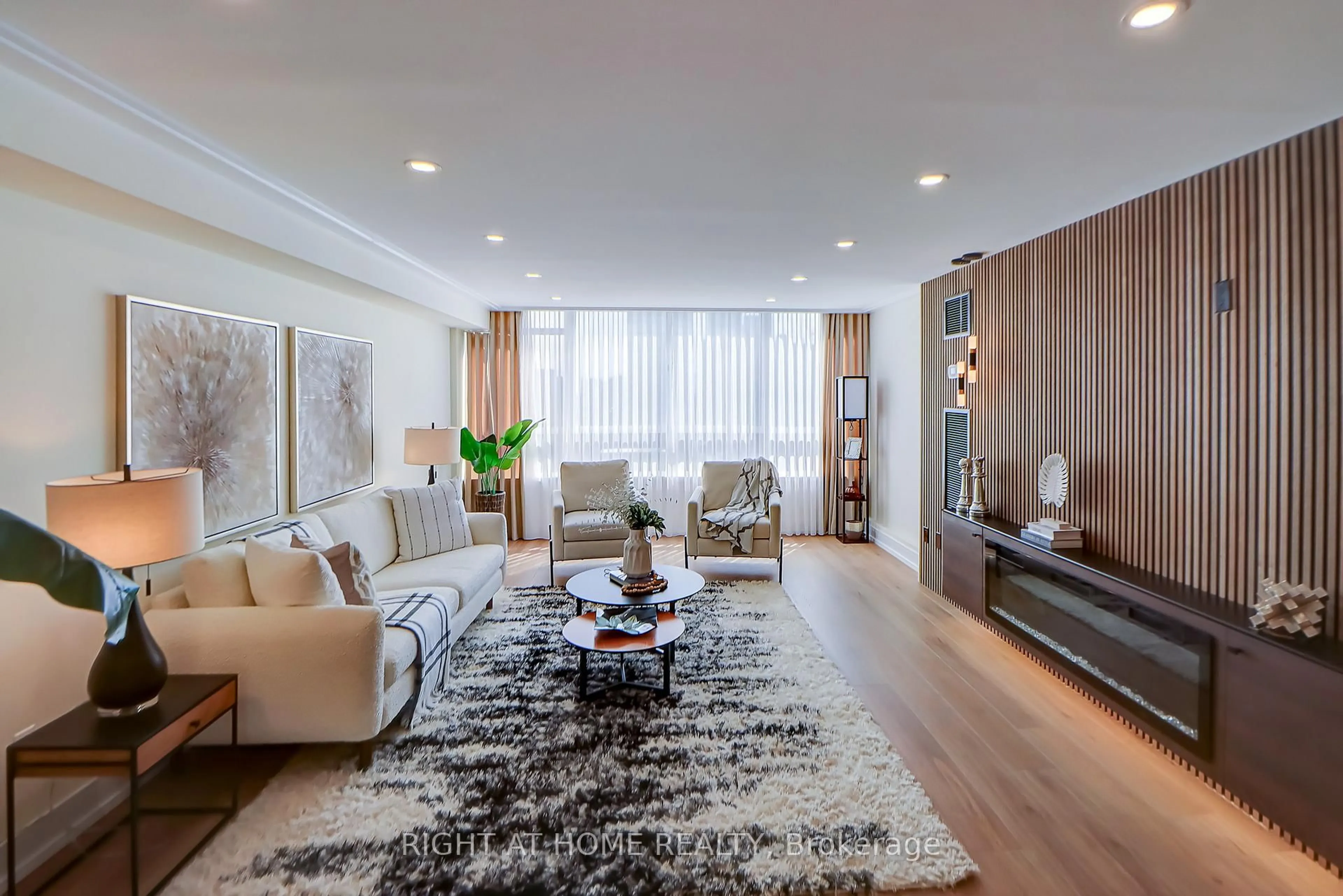 Living room with furniture, wood/laminate floor for 130 Carlton St #1207, Toronto Ontario M5A 4K3