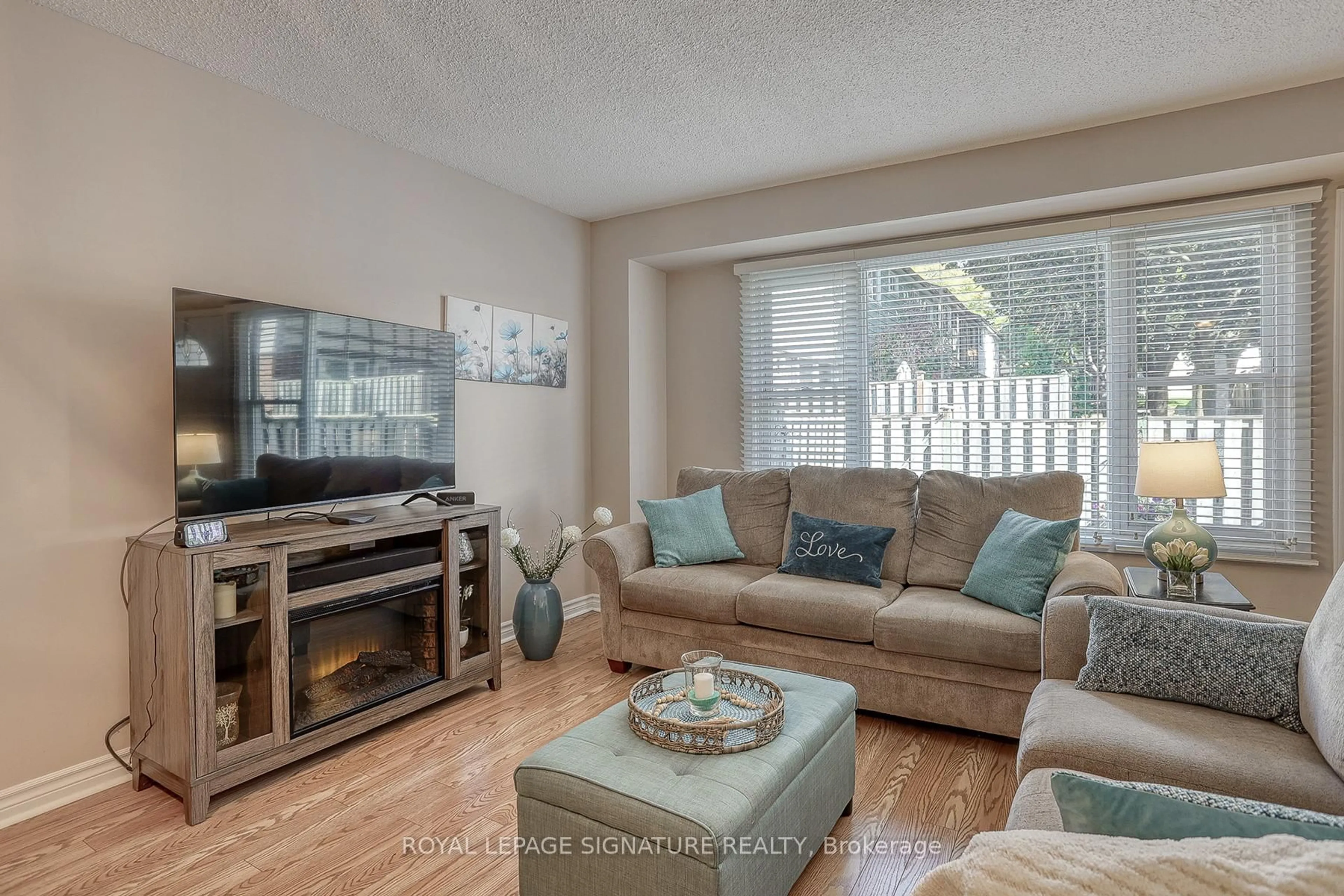Living room with furniture, wood/laminate floor for 5 Golden Appleway, Toronto Ontario M3A 0H5