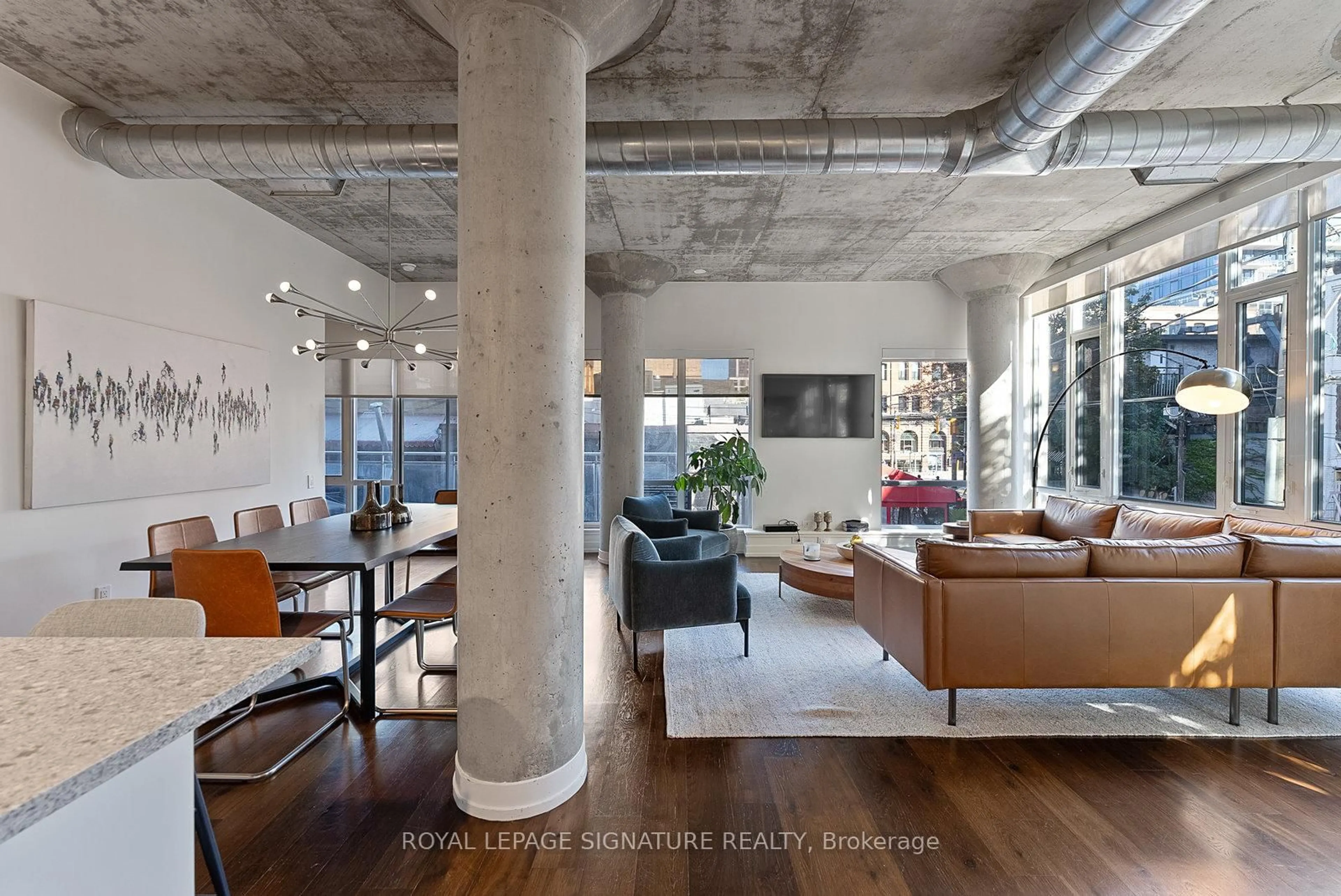 Living room with furniture, cement floor for 66 Portland St #201, Toronto Ontario M5V 2M6