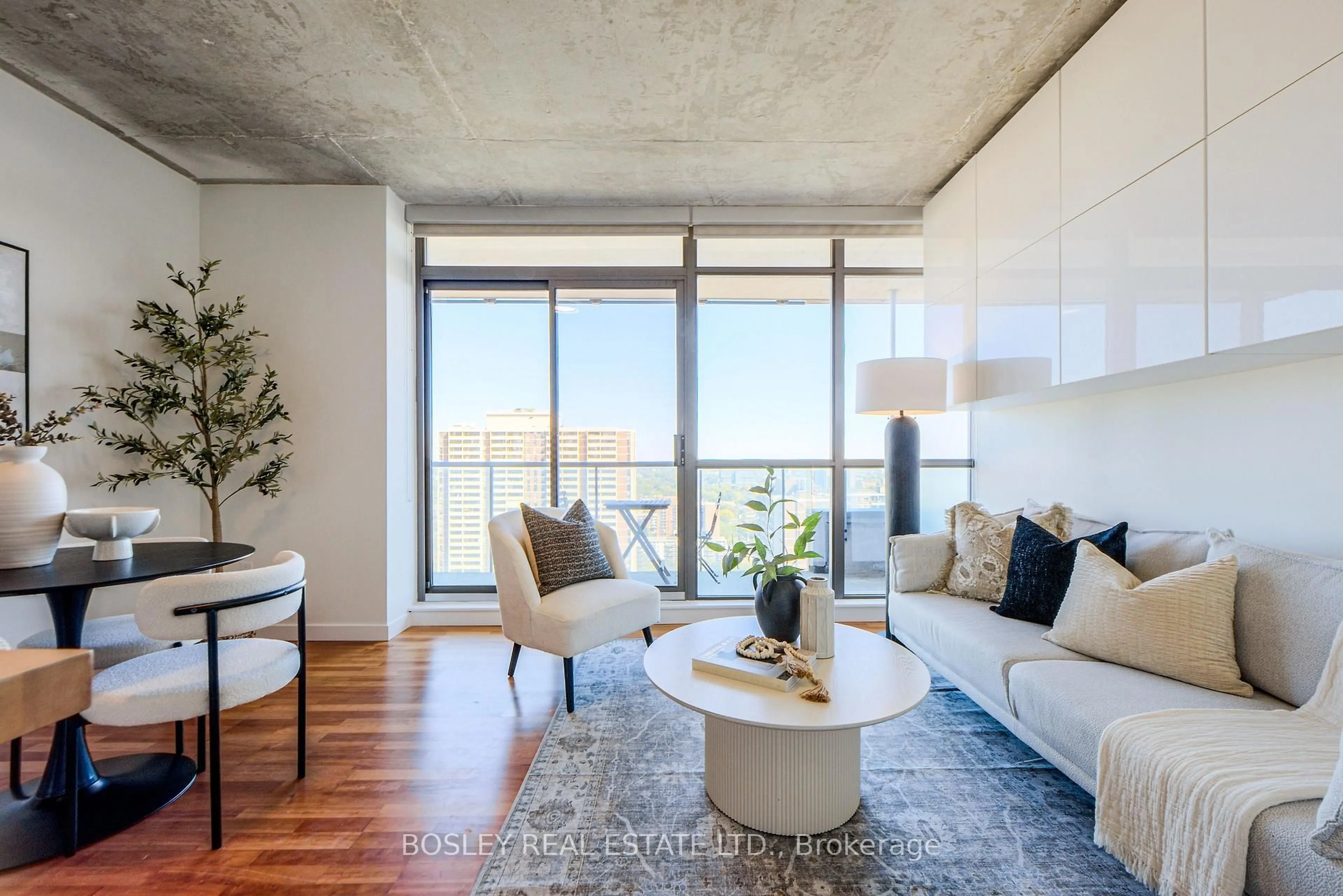Living room with furniture, cement floor for 281 Mutual St #2507, Toronto Ontario M4Y 3C4