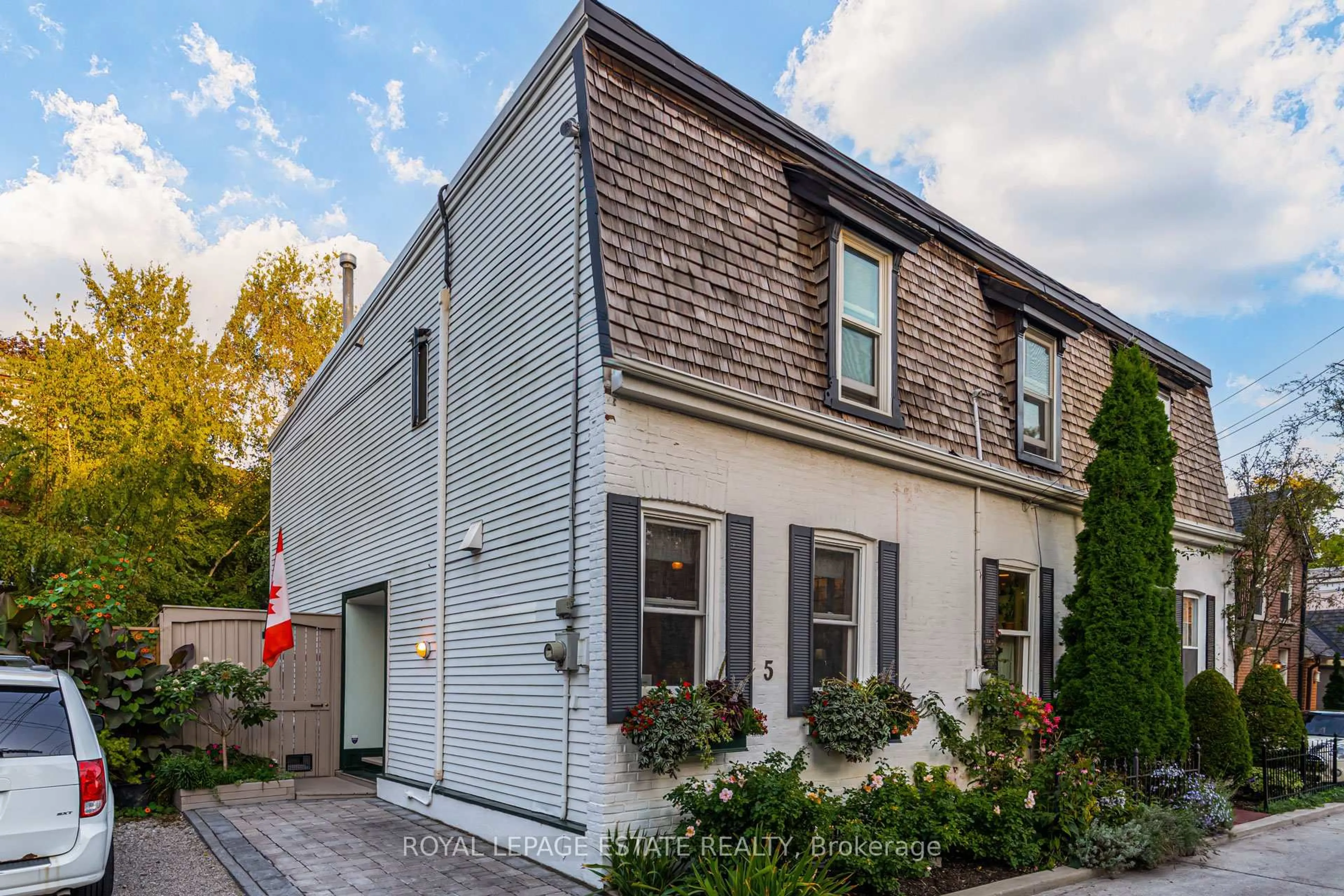 Home with brick exterior material, street for 5 Woodstock Pl, Toronto Ontario M4X 1T7