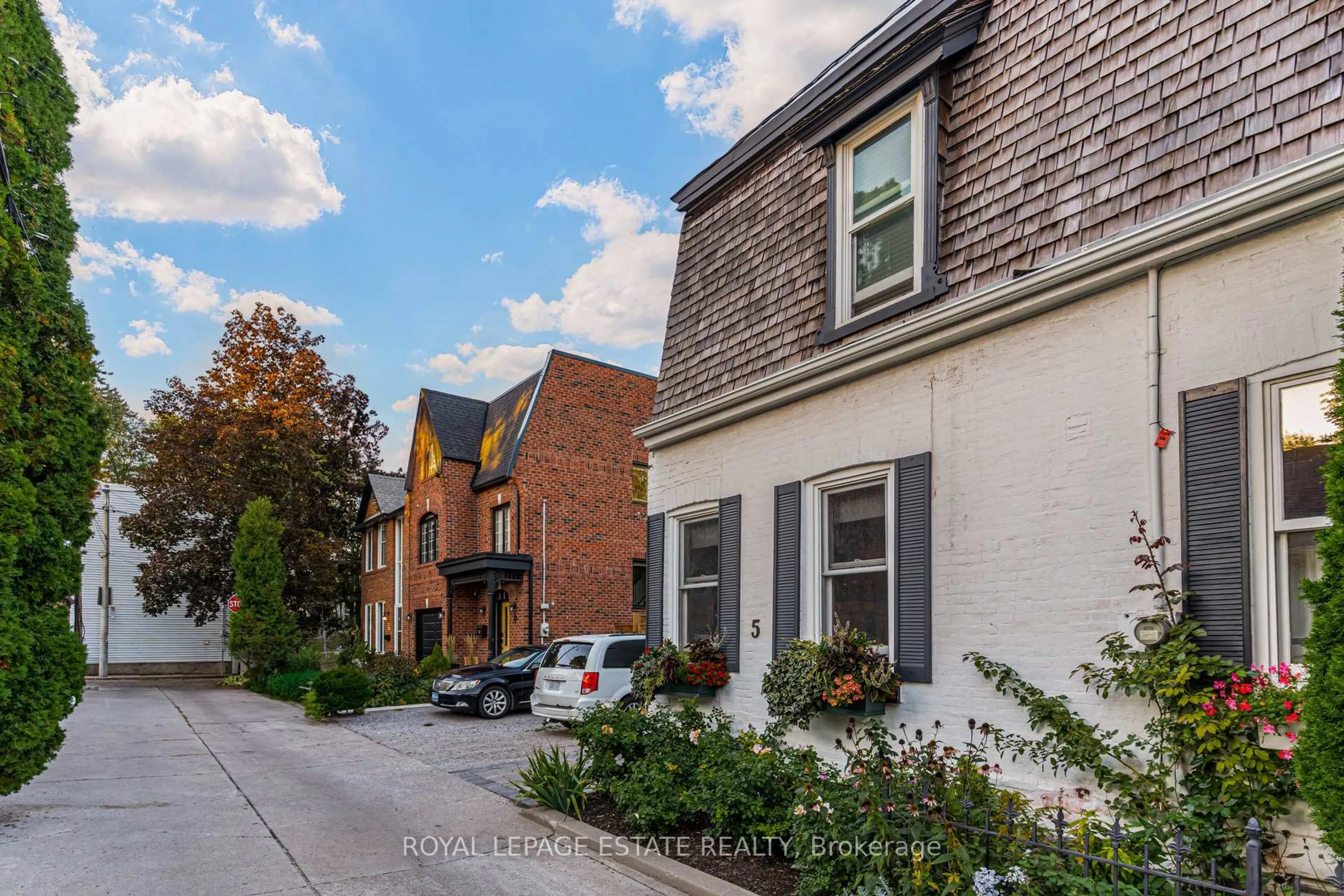 Home with brick exterior material, street for 5 Woodstock Pl, Toronto Ontario M4X 1T7