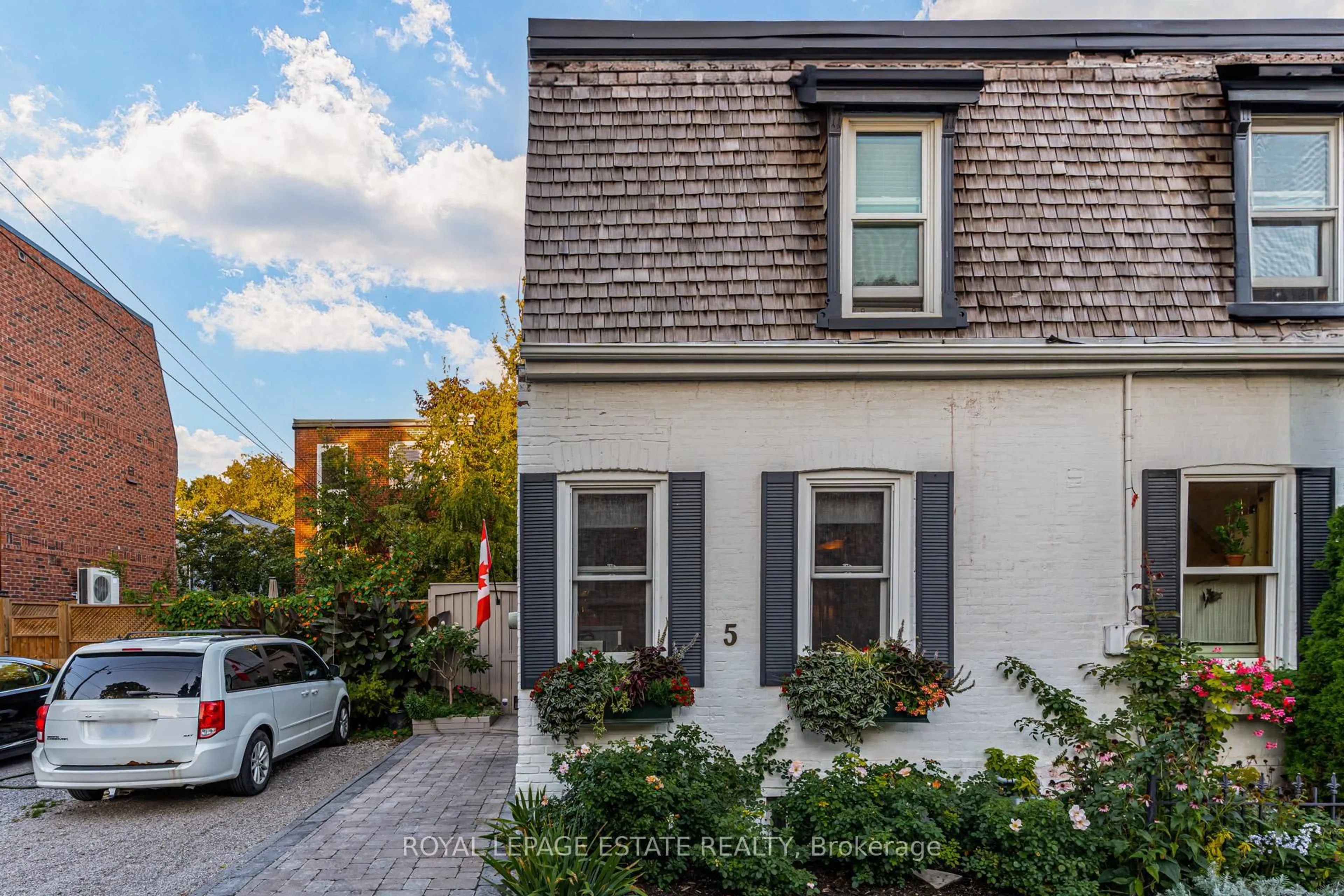 Home with brick exterior material, street for 5 Woodstock Pl, Toronto Ontario M4X 1T7