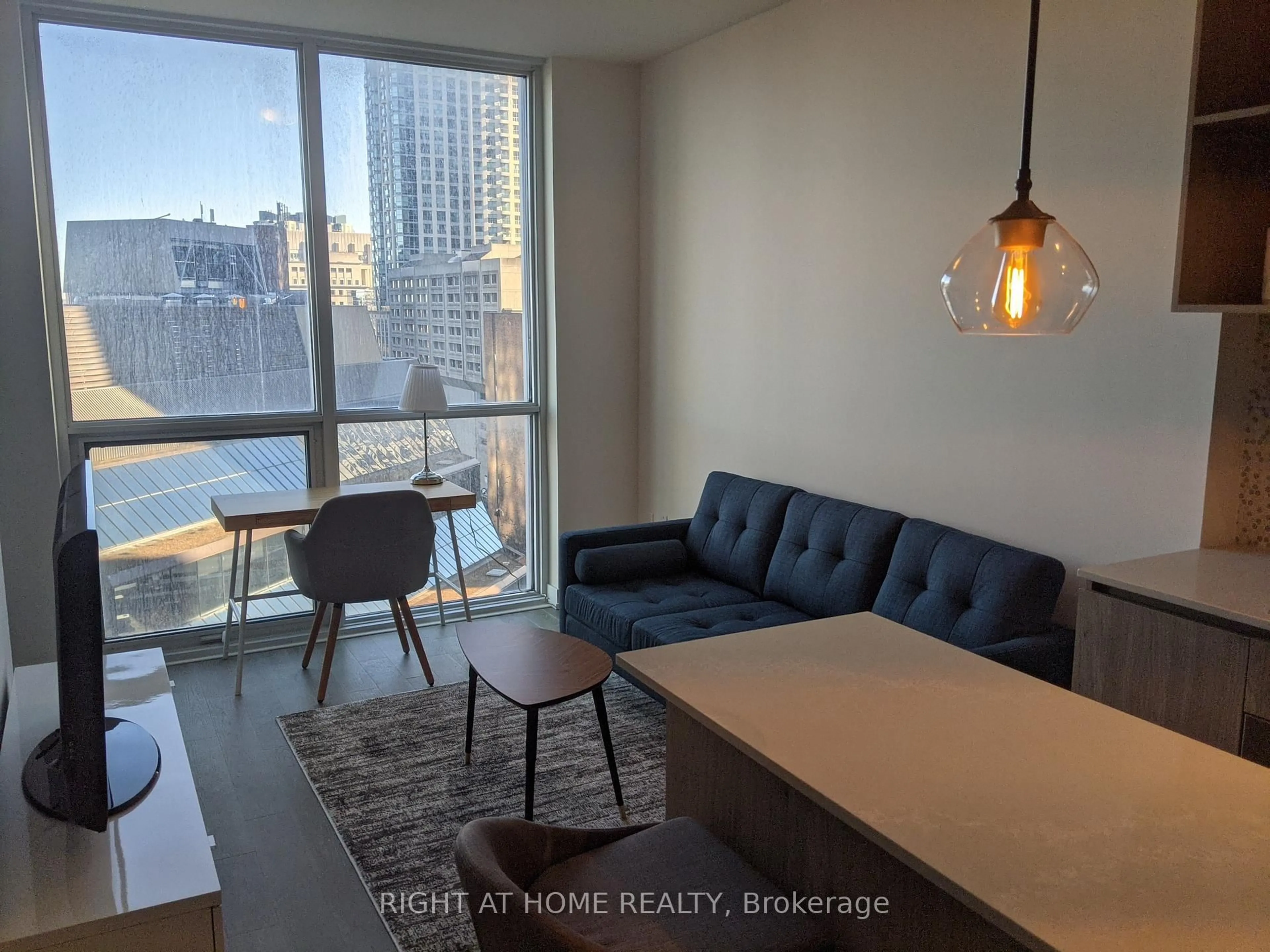 Living room with furniture, wood/laminate floor for 1 Yorkville Ave #1010, Toronto Ontario M4W 0B1