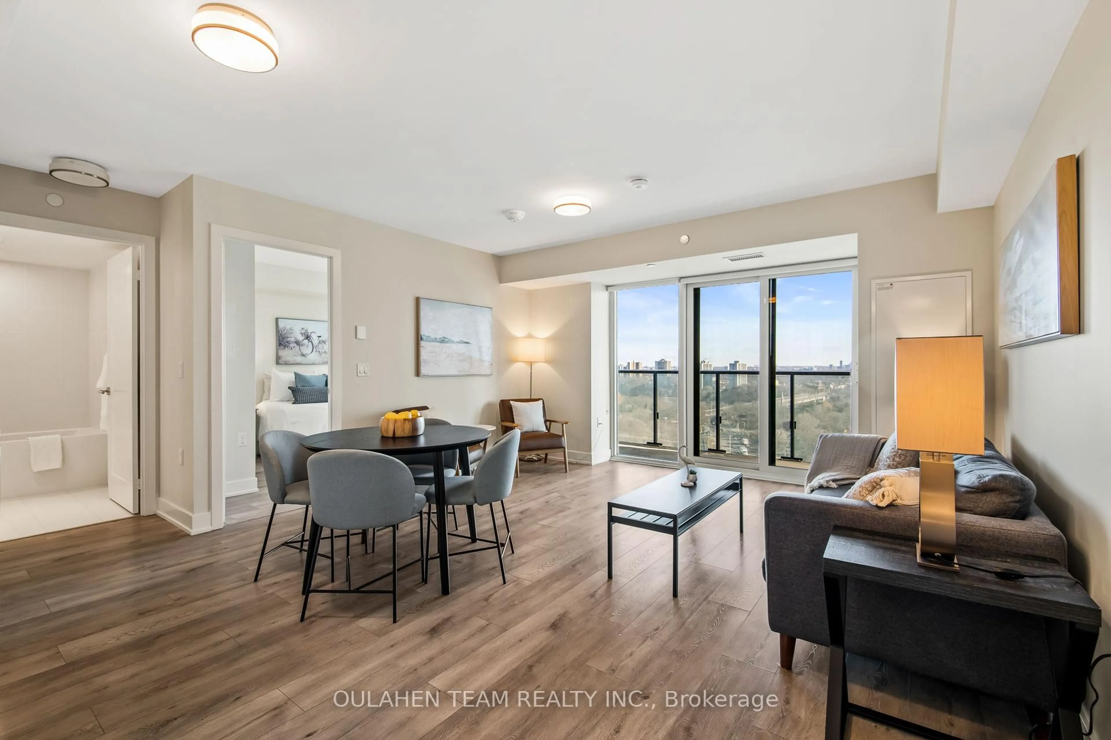 Living room with furniture, wood/laminate floor for 575 Bloor St #1704, Toronto Ontario M4W 0B2