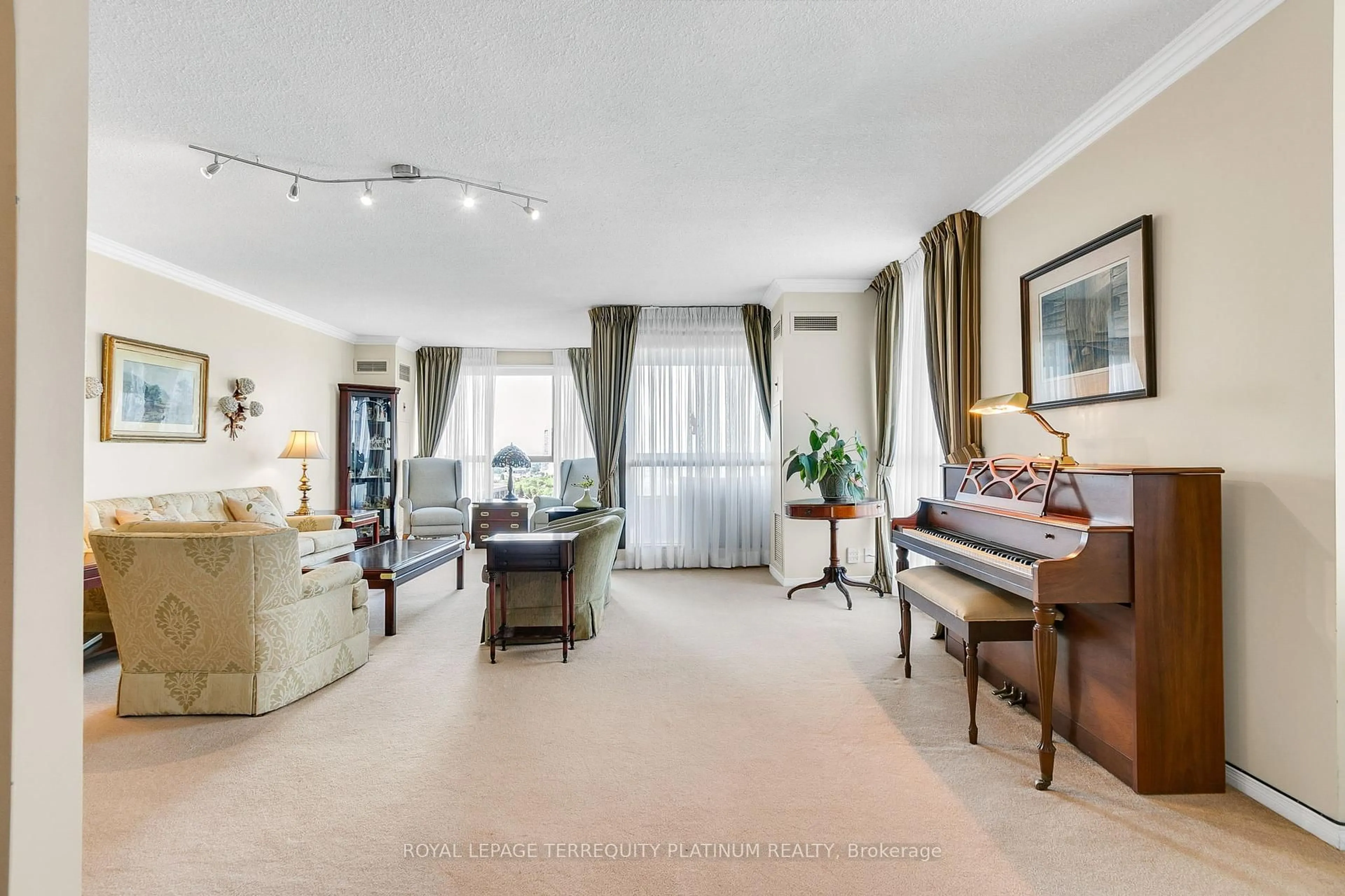 Living room with furniture, carpet floor for 3 Concorde Pl #1202, Toronto Ontario M3C 3K7