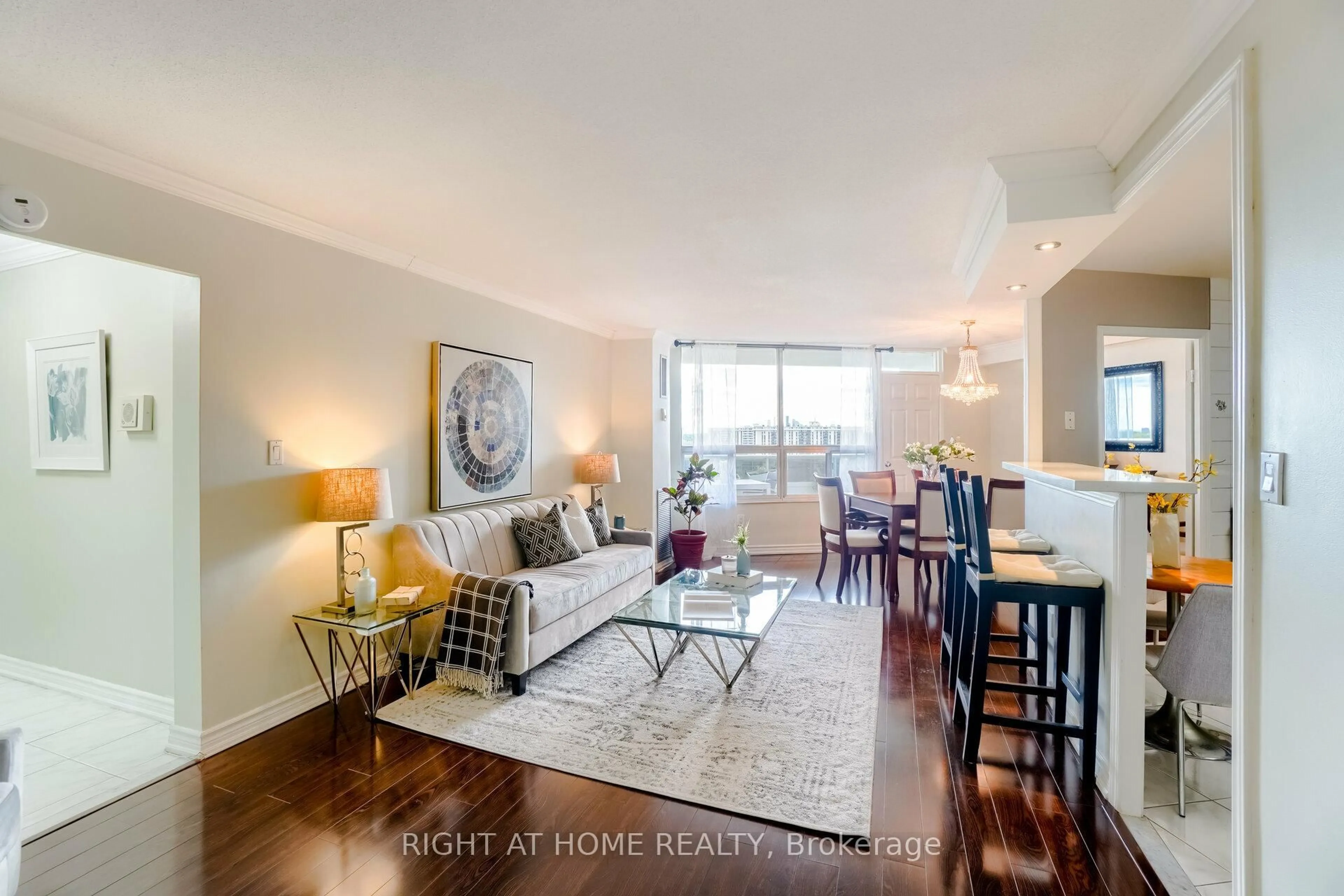 Living room with furniture, wood/laminate floor for 5 Shady Gfwy #1607, Toronto Ontario M3C 3A5