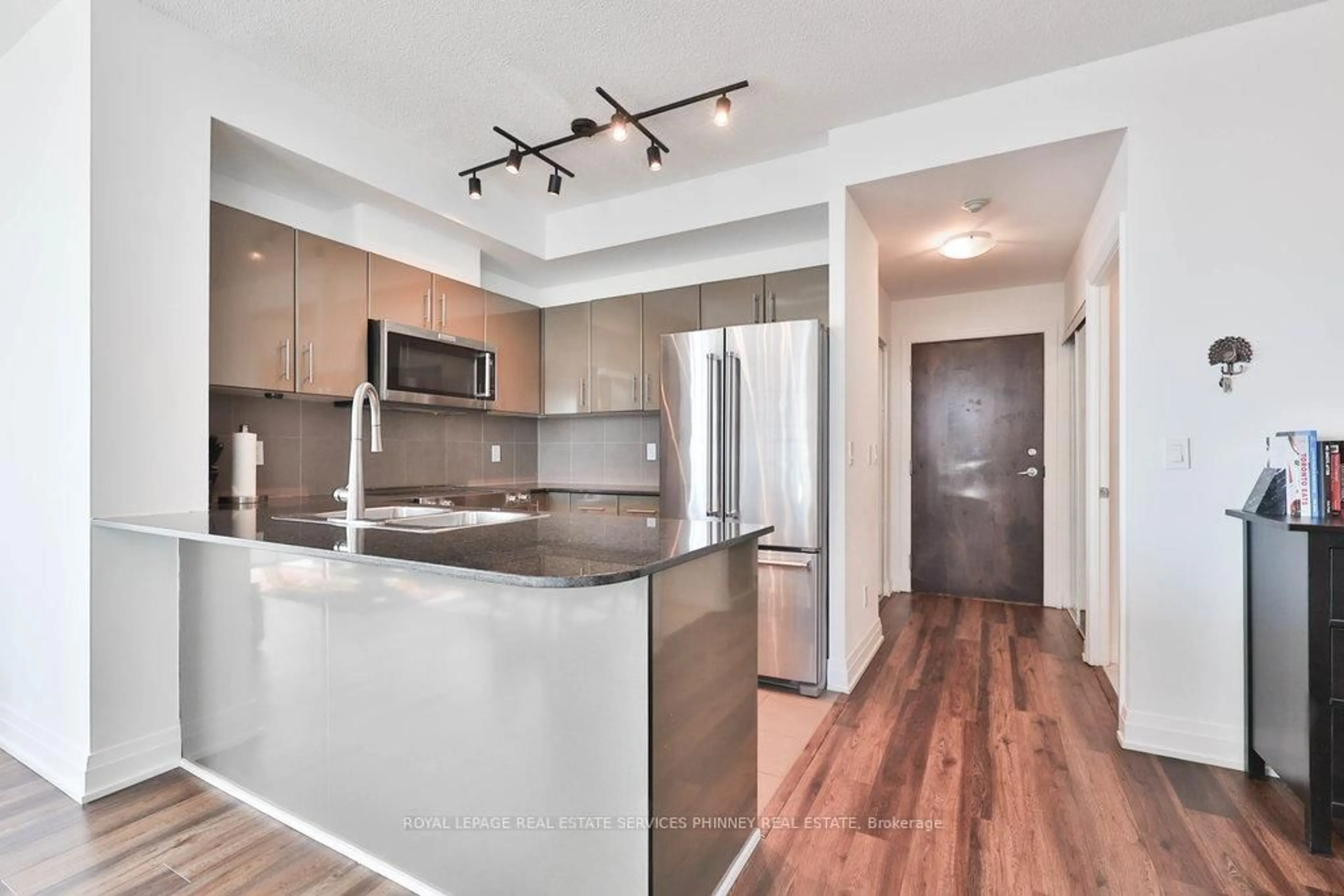 Open concept kitchen, wood/laminate floor for 16 Yonge St #3109, Toronto Ontario M5E 2A1
