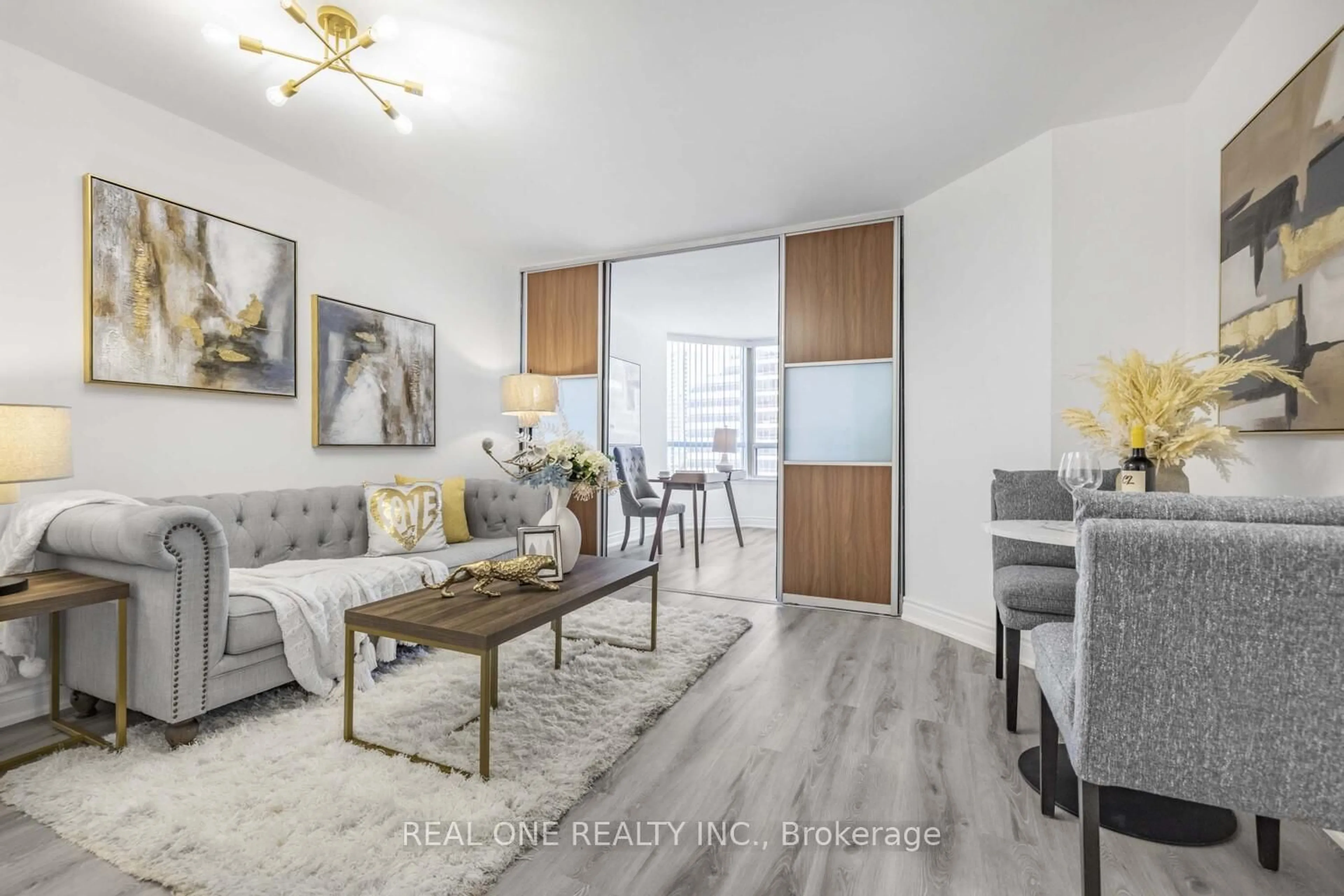 Living room with furniture, wood/laminate floor for 7 Bishop Ave #1015, Toronto Ontario M2M 4J4