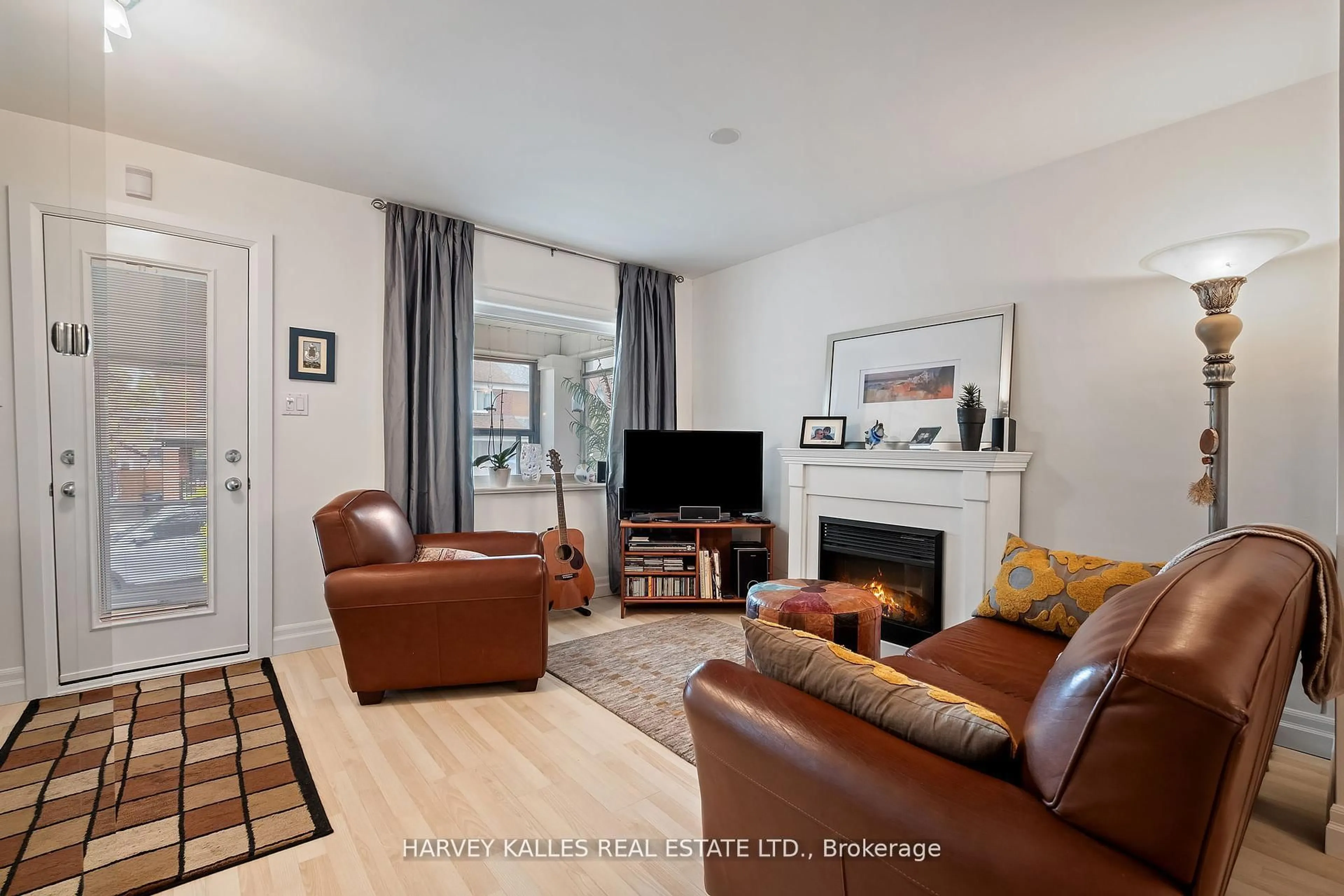Living room with furniture, wood/laminate floor for 291 Arlington Ave, Toronto Ontario M6C 2Z8