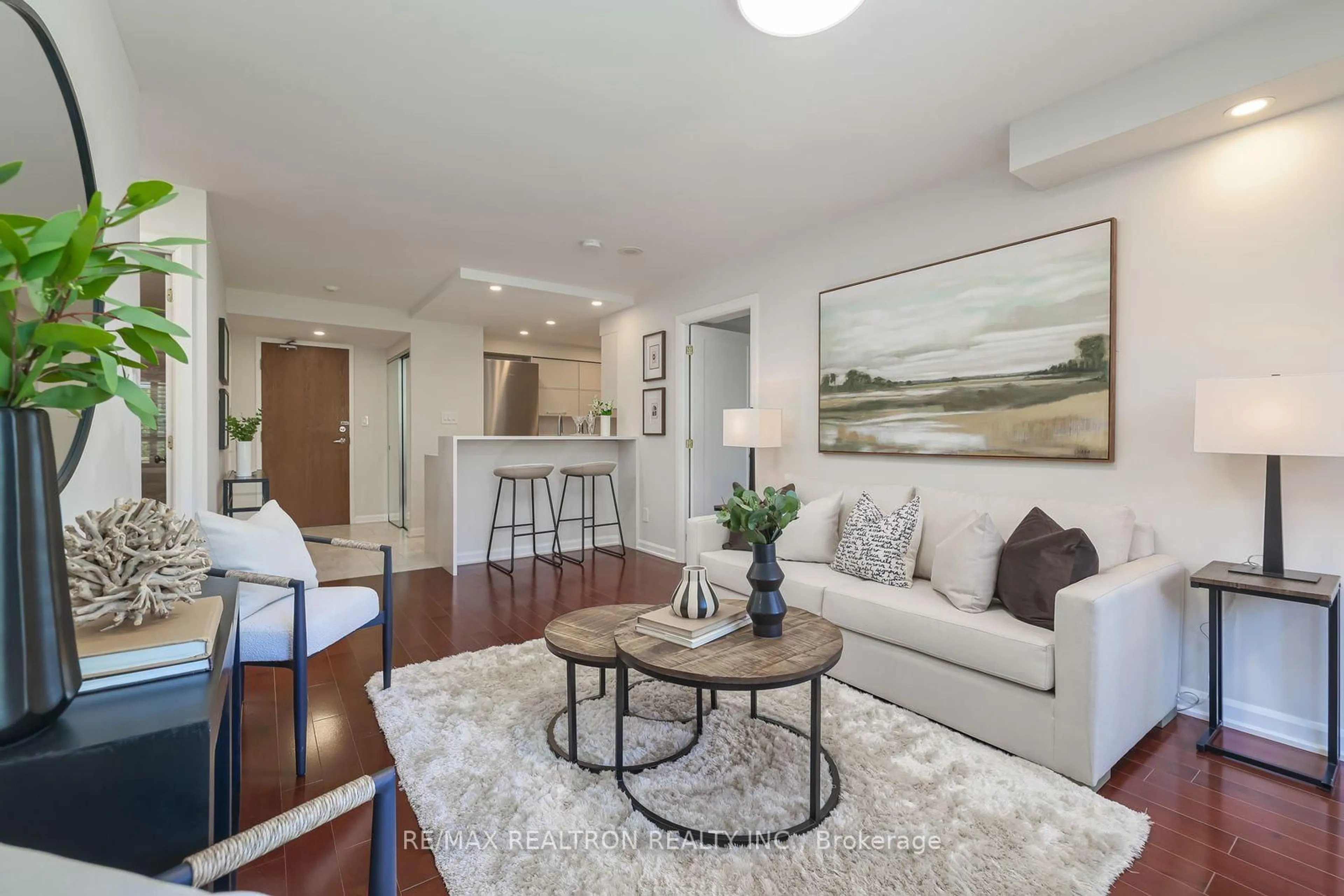 Living room with furniture, wood/laminate floor for 233 Beecroft Rd #402, Toronto Ontario M2N 6Z9