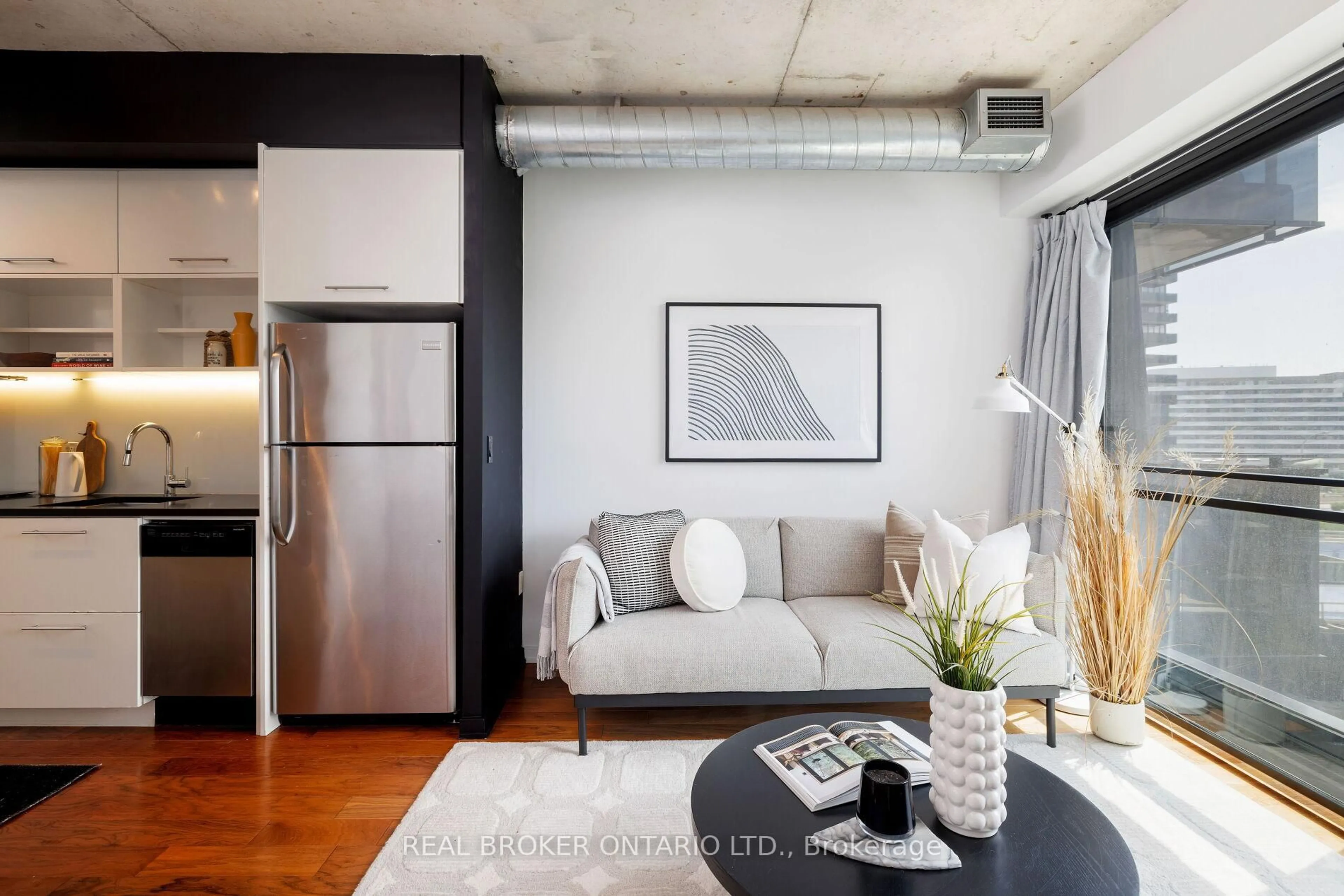 Living room with furniture, cement floor for 47 Lower River St #539, Toronto Ontario M5A 0G1