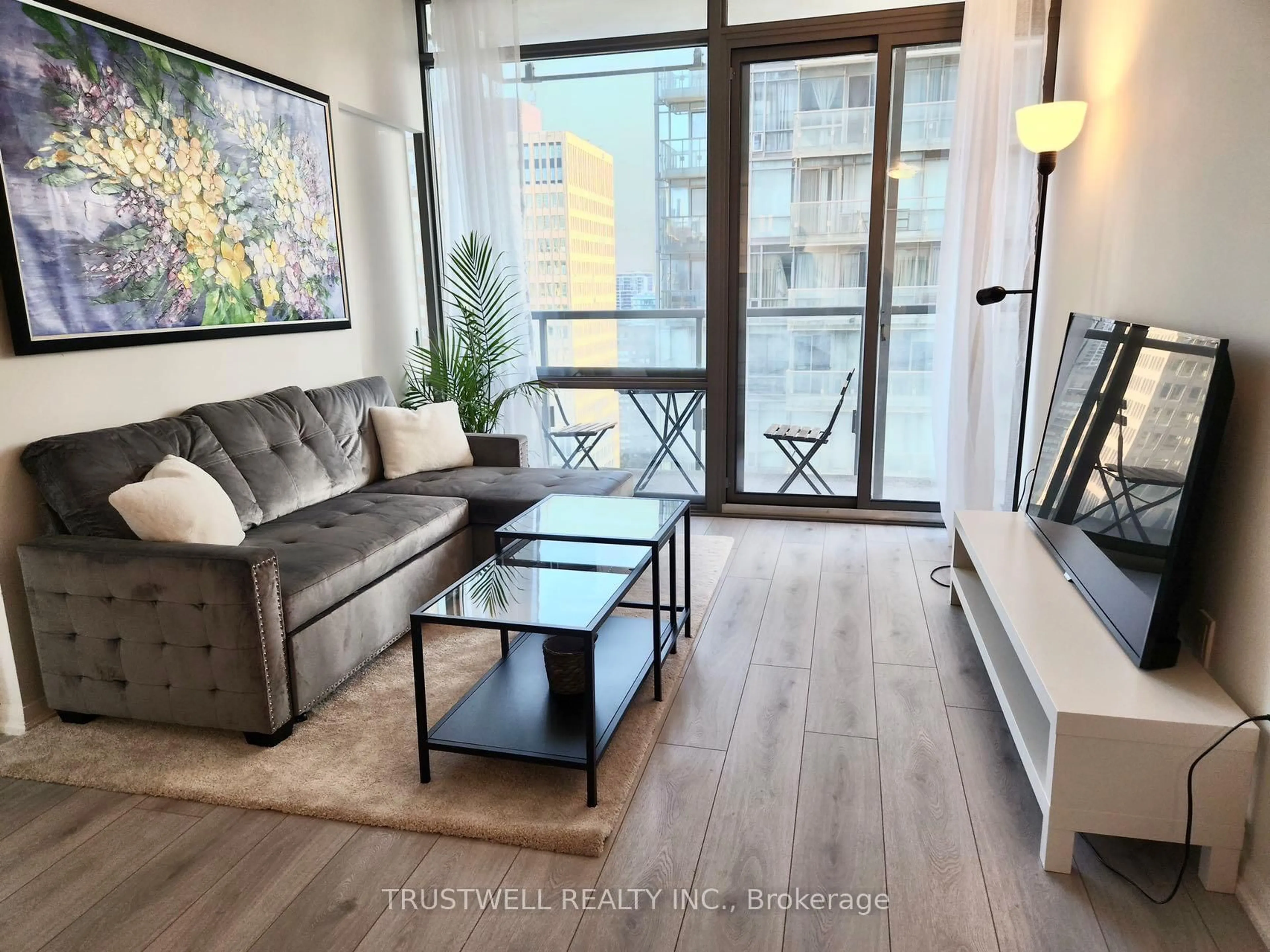 Living room with furniture, wood/laminate floor for 38 Grenville St #2601, Toronto Ontario M4Y 1A5