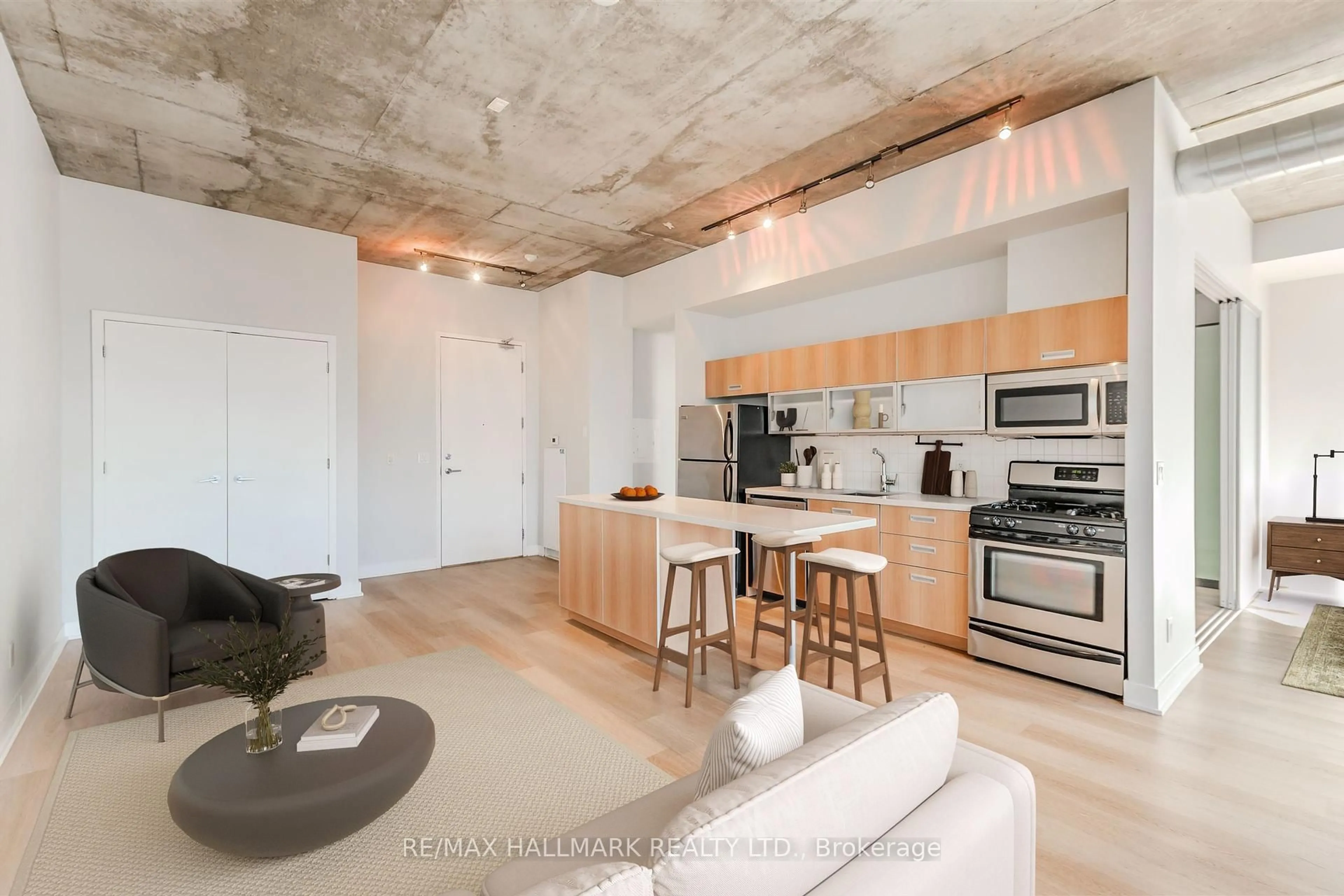 Open concept kitchen, cement floor for 60 Bathurst St #910, Toronto Ontario M5V 2P4