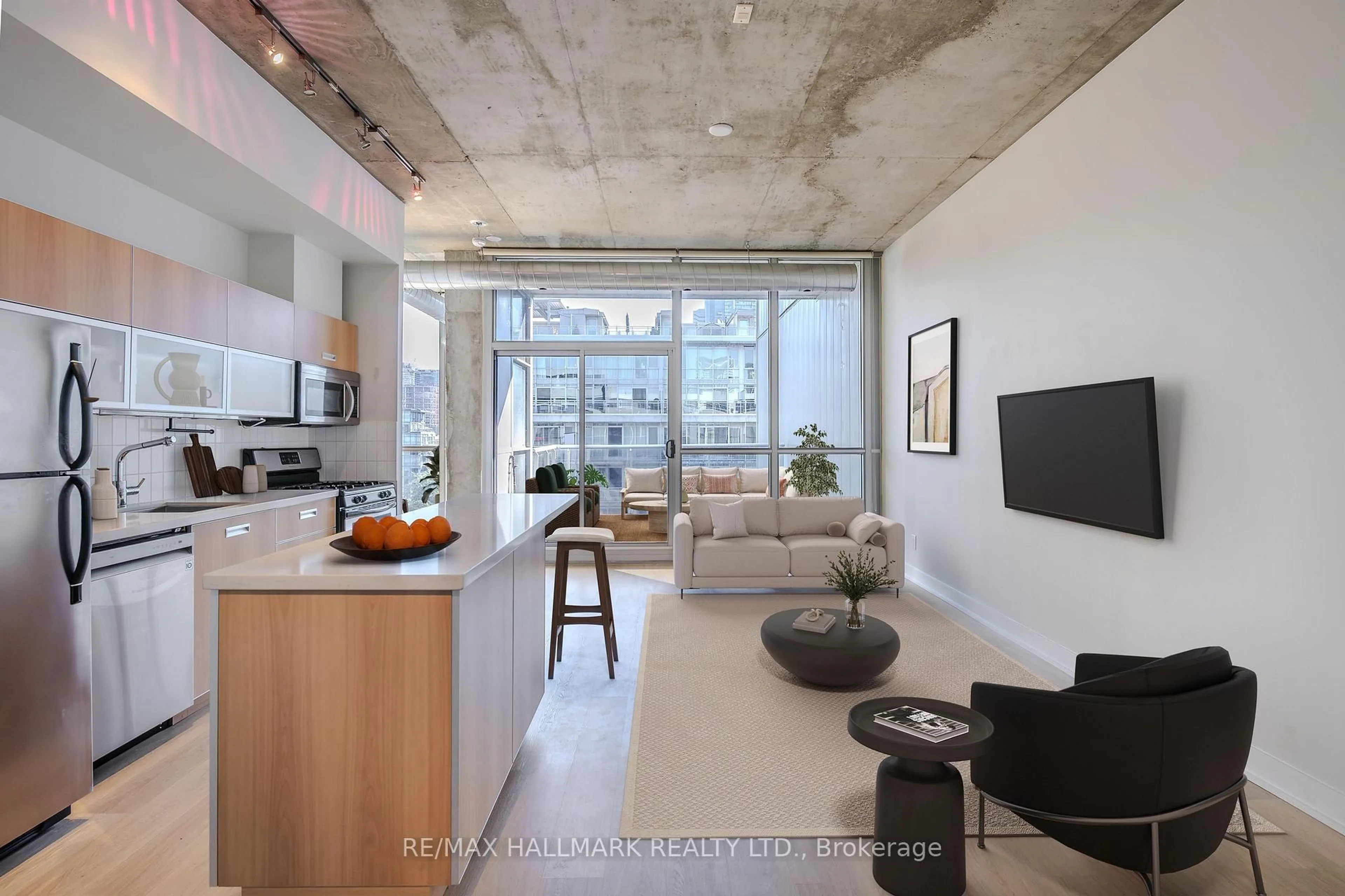 Open concept kitchen, cement floor for 60 Bathurst St #910, Toronto Ontario M5V 2P4