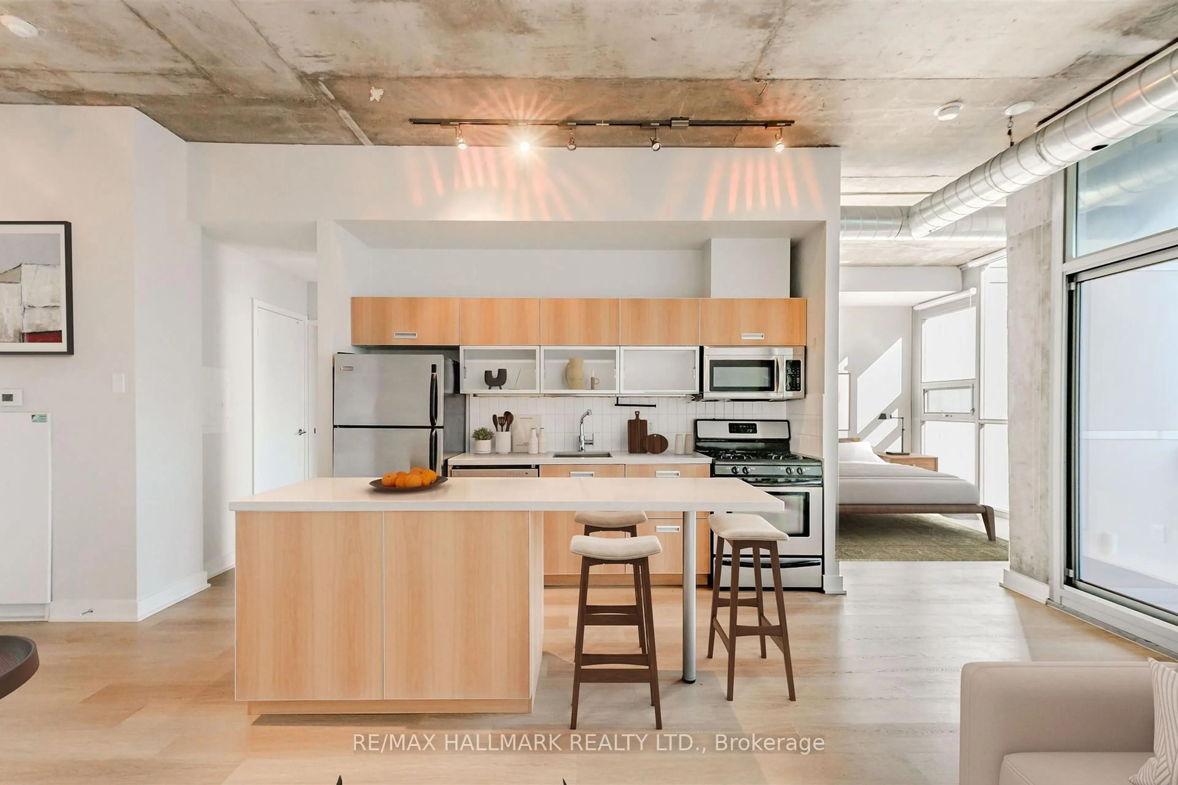 Open concept kitchen, cement floor for 60 Bathurst St #910, Toronto Ontario M5V 2P4