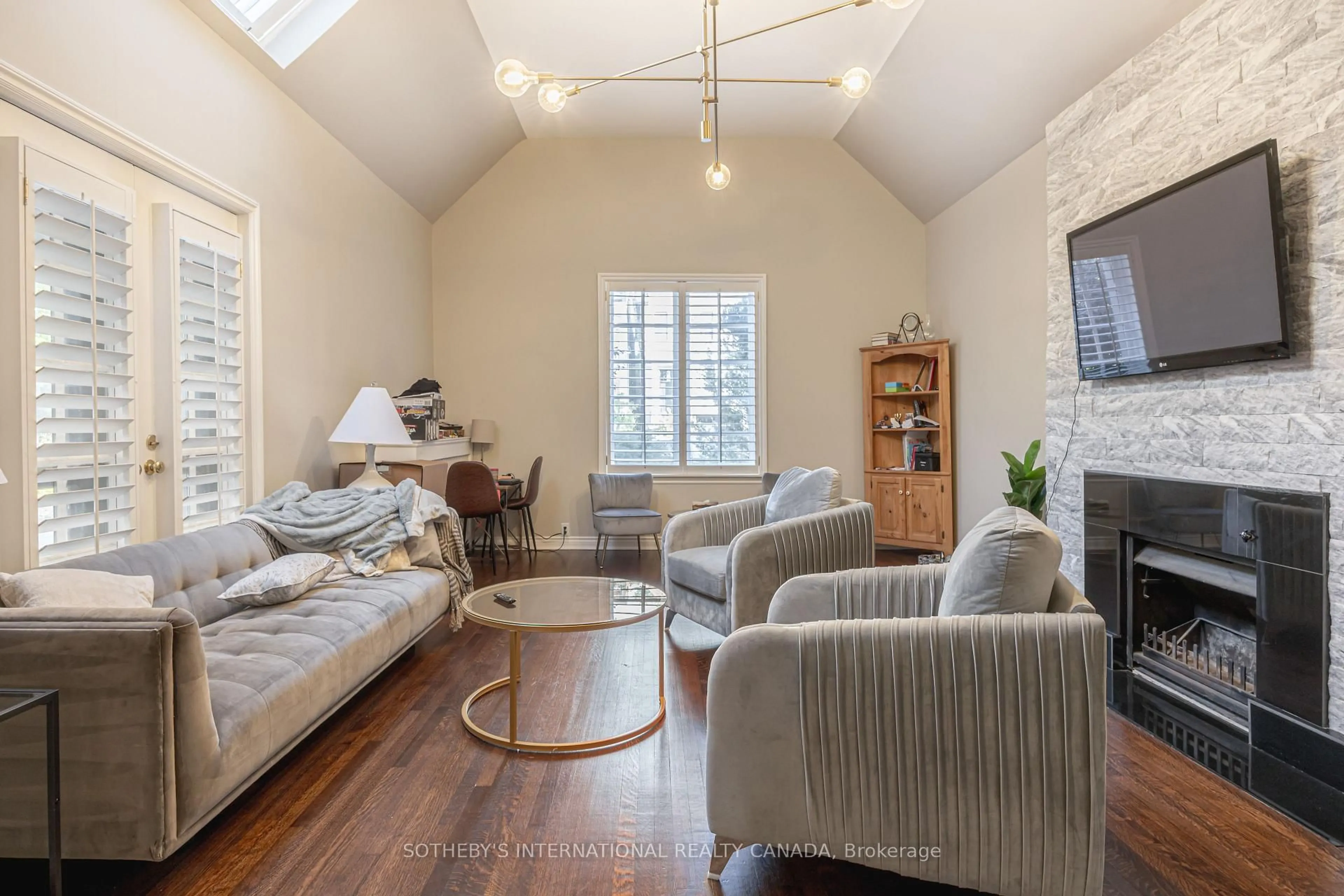 Living room with furniture, wood/laminate floor for 65 St Germain Ave, Toronto Ontario M5M 1V9