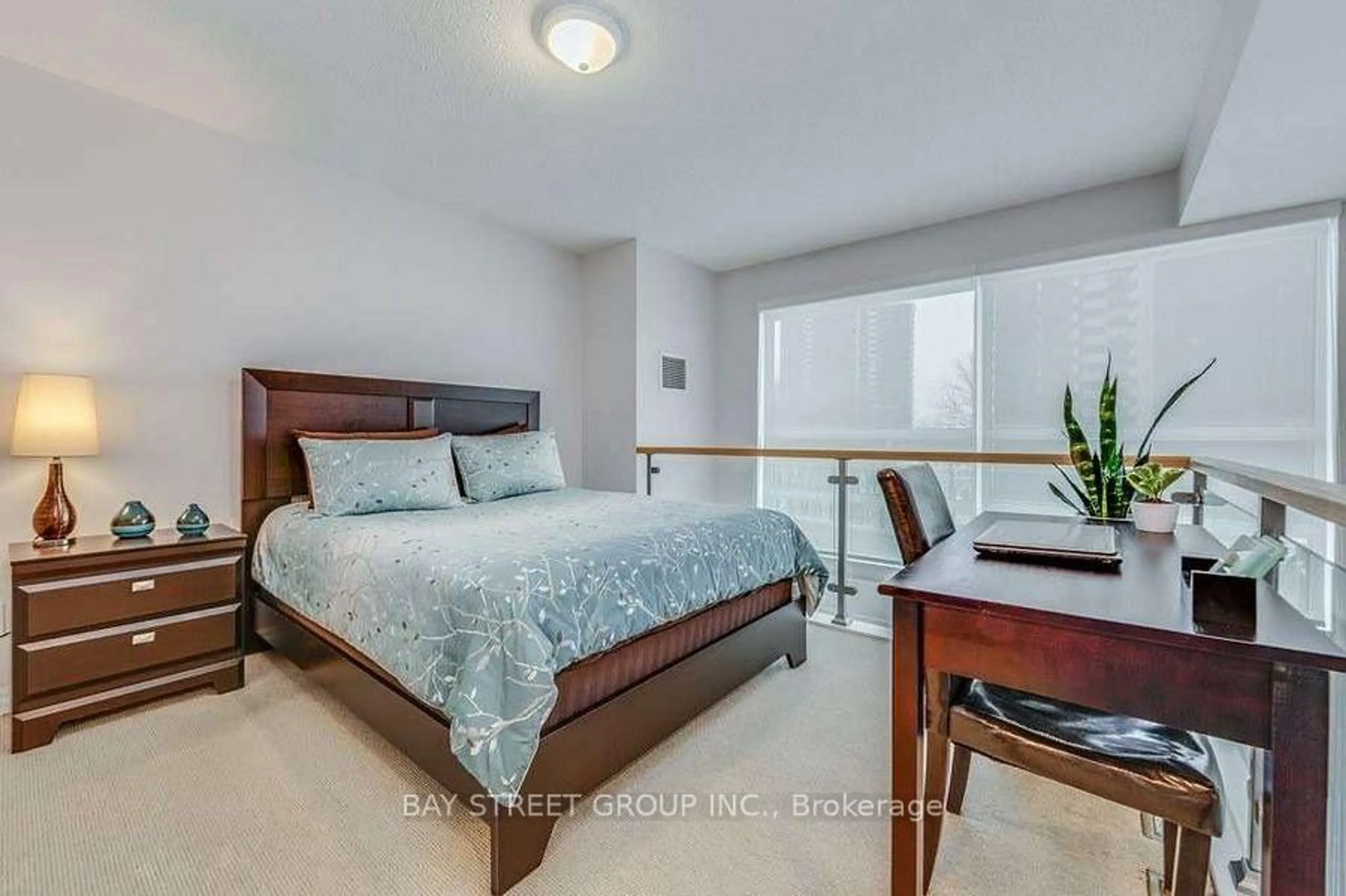 Bedroom with bed, wood/laminate floor for 2035 Sheppard Ave #127, Toronto Ontario M2J 0A8