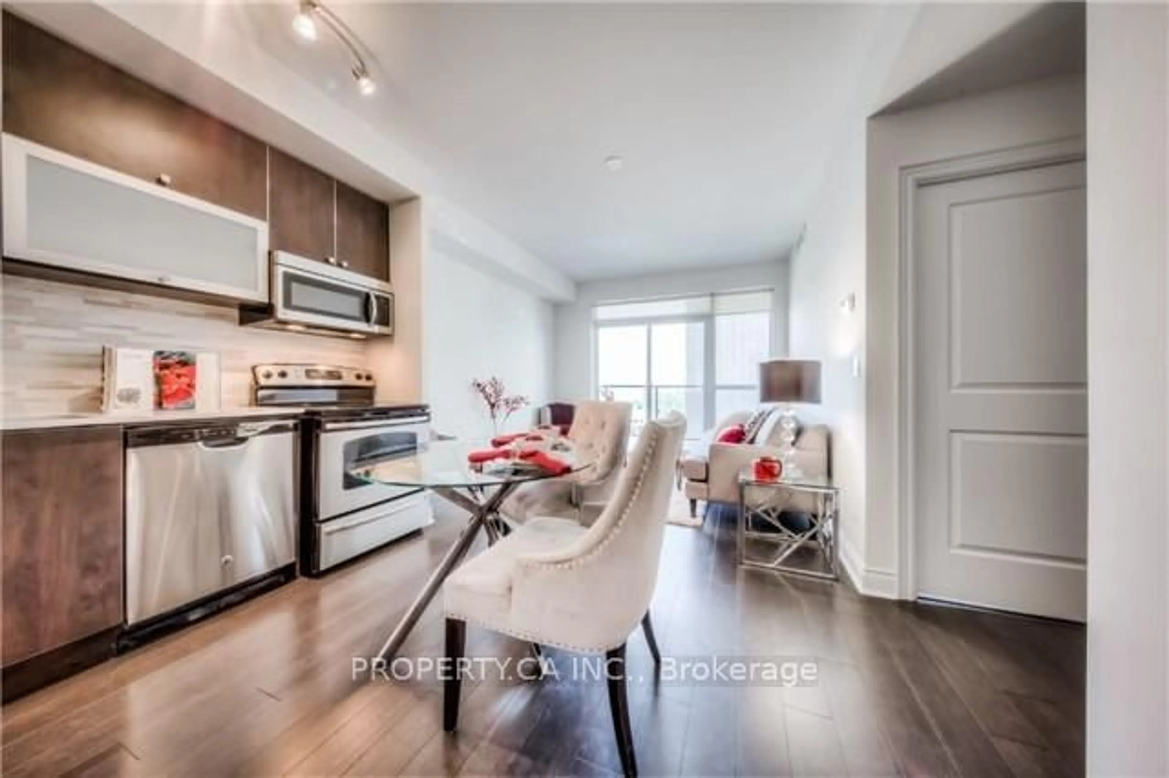 Open concept kitchen, wood/laminate floor for 28 Ted Rogers Way #2410, Toronto Ontario M4Y 2J4
