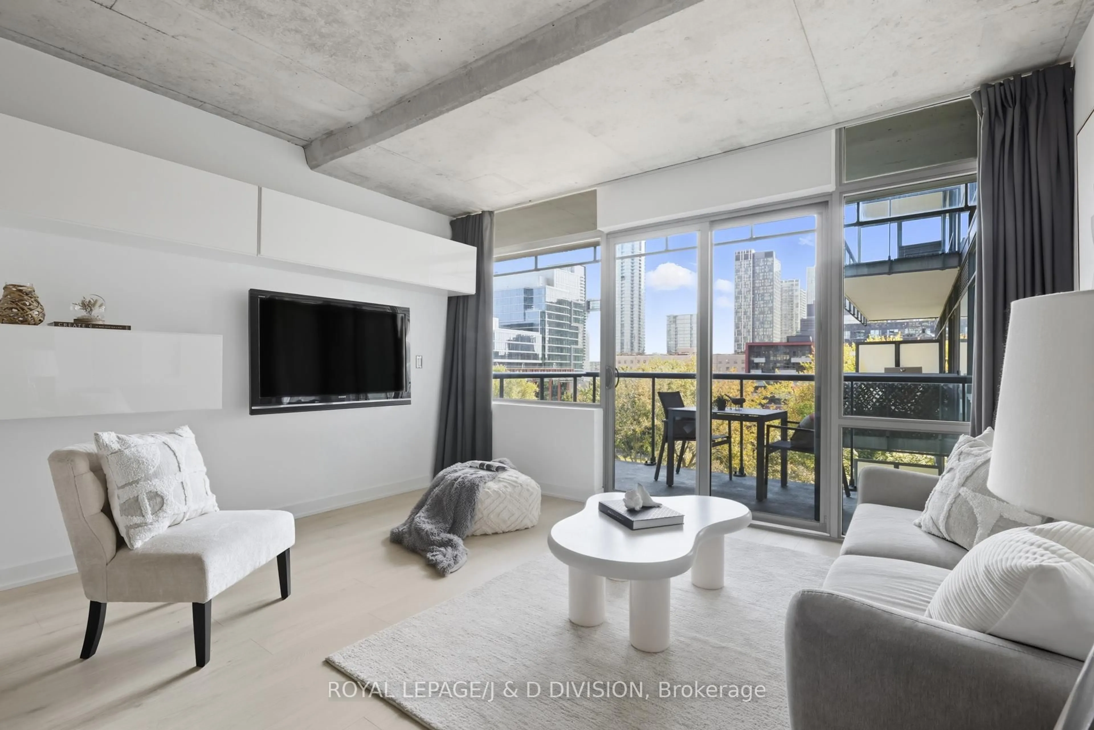 Living room with furniture, cement floor for 55 Stewart St #828, Toronto Ontario M5V 2V1