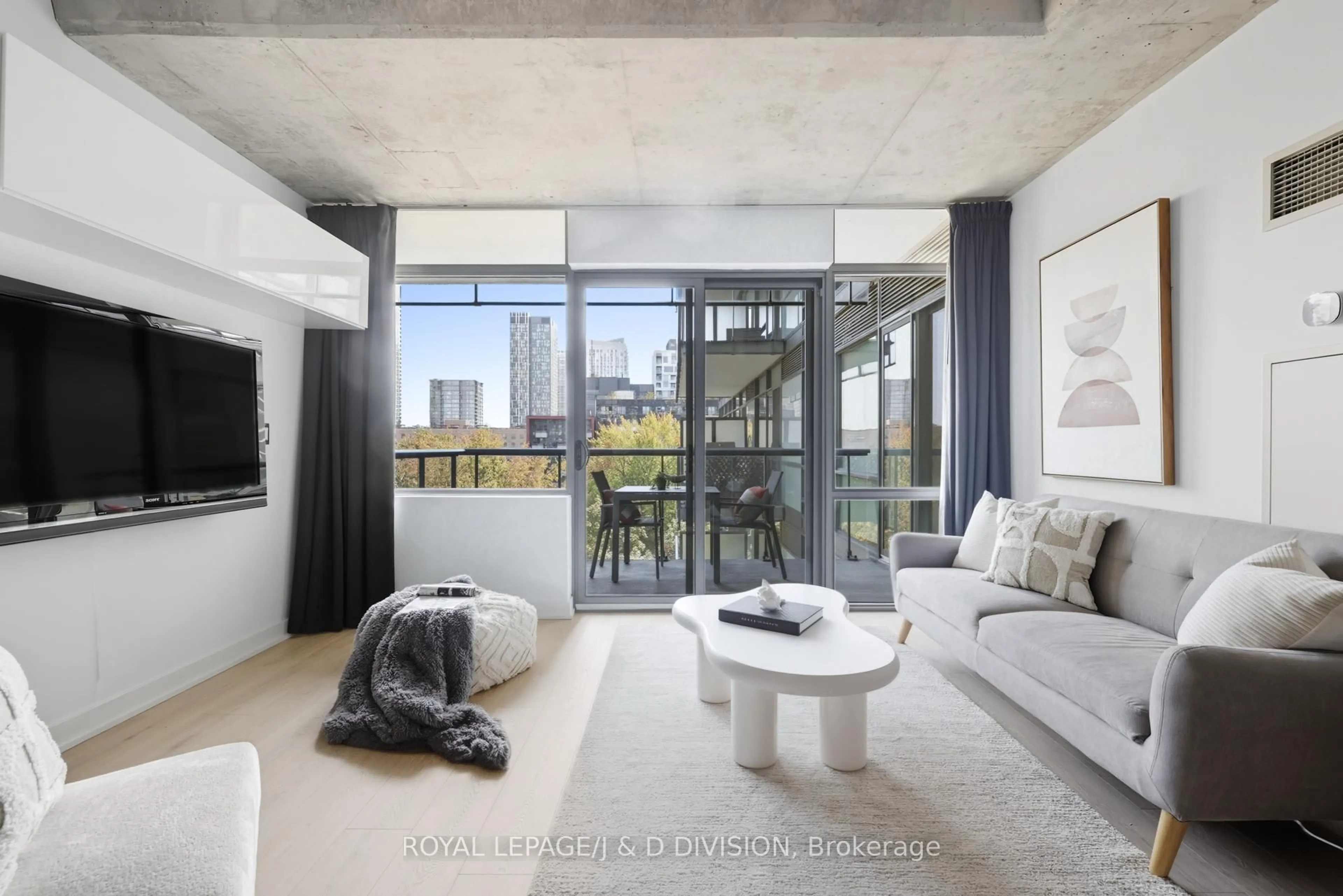 Living room with furniture, cement floor for 55 Stewart St #828, Toronto Ontario M5V 2V1