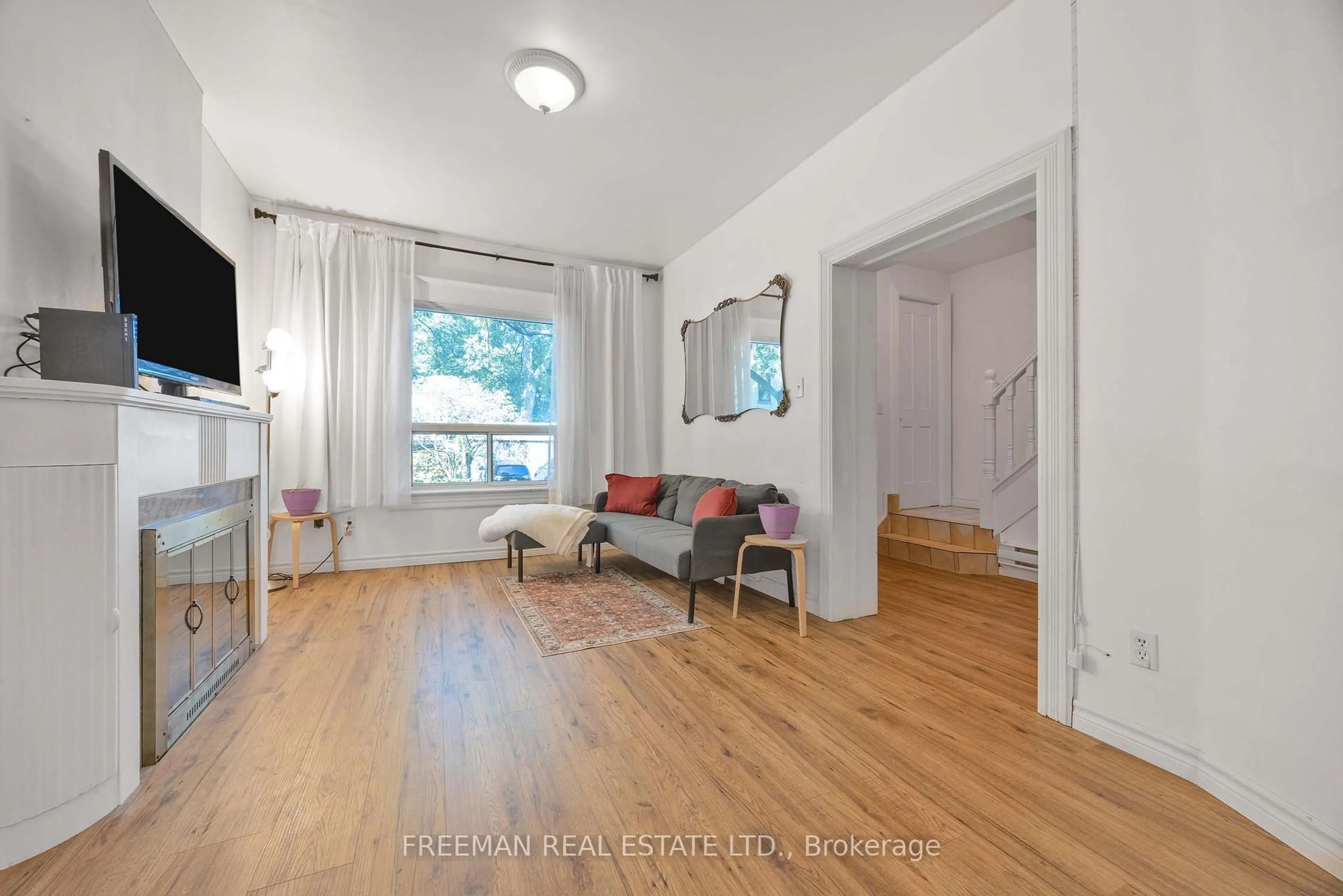 Living room with furniture, wood/laminate floor for 21 London St, Toronto Ontario M6G 1M8