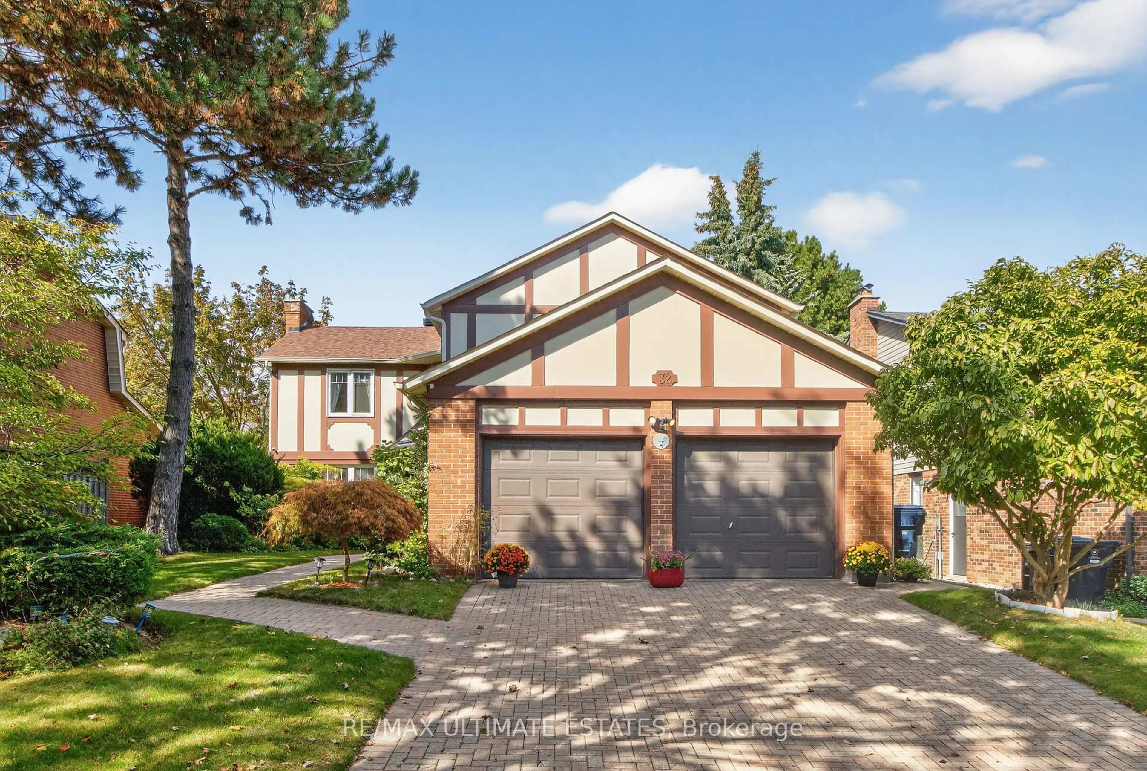 Home with brick exterior material, street for 32 Mossgrove Tr, Toronto Ontario M2L 2W3