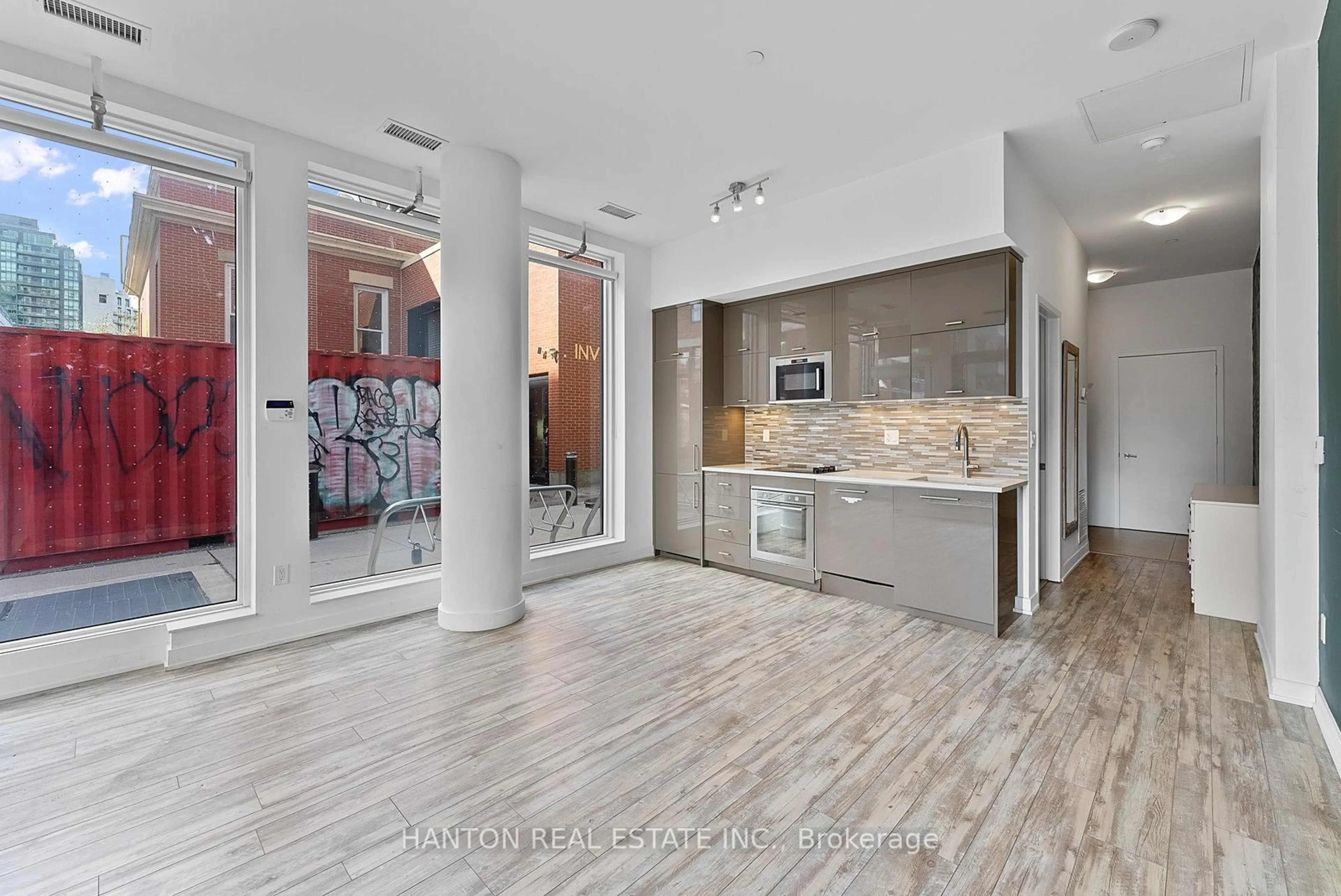 Open concept kitchen, ceramic/tile floor for 106 Dovercourt Rd #105, Toronto Ontario M6J 1J1