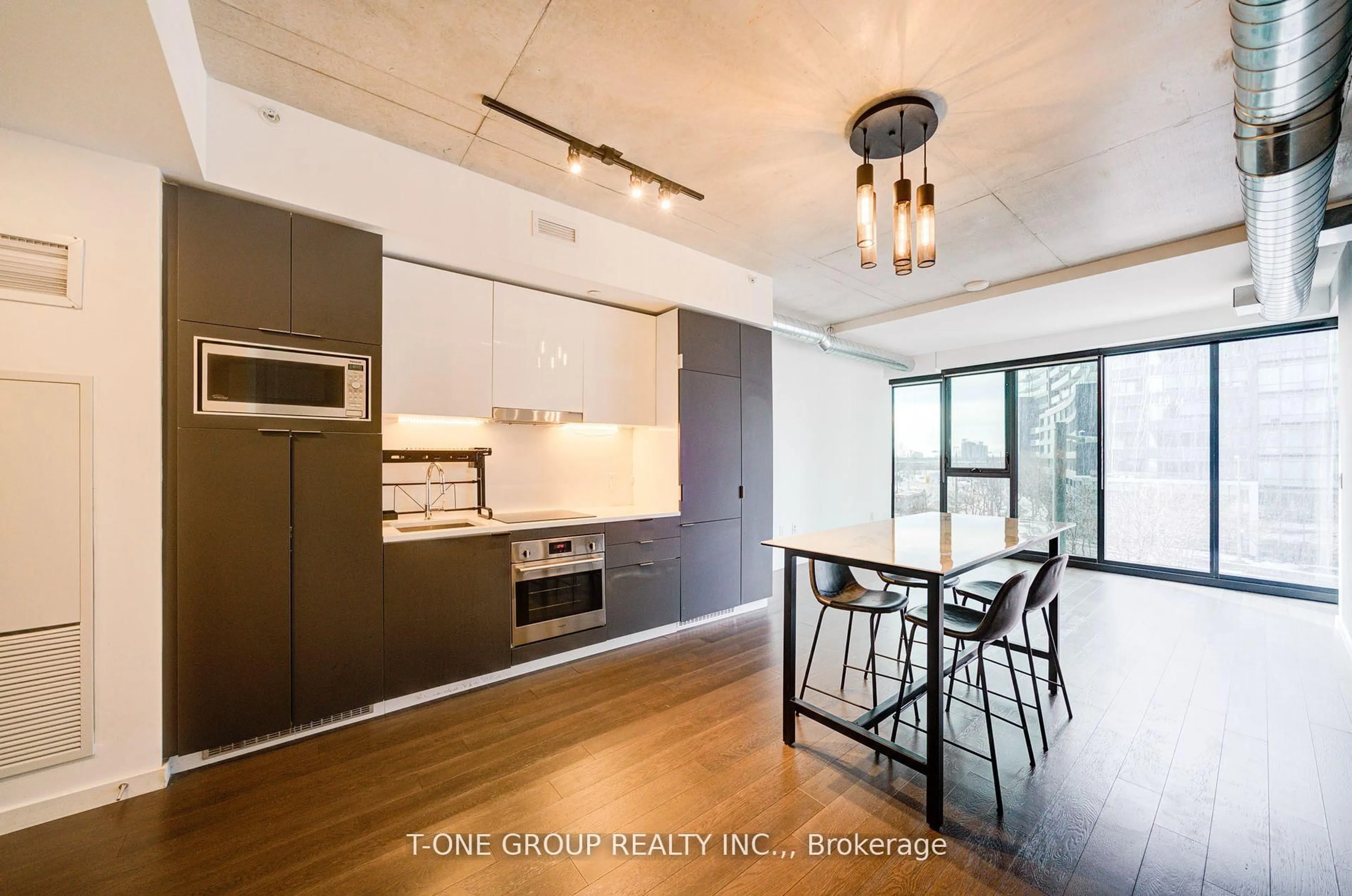 Open concept kitchen, wood/laminate floor for 170 Bayview Ave #314, Toronto Ontario M5A 0M4