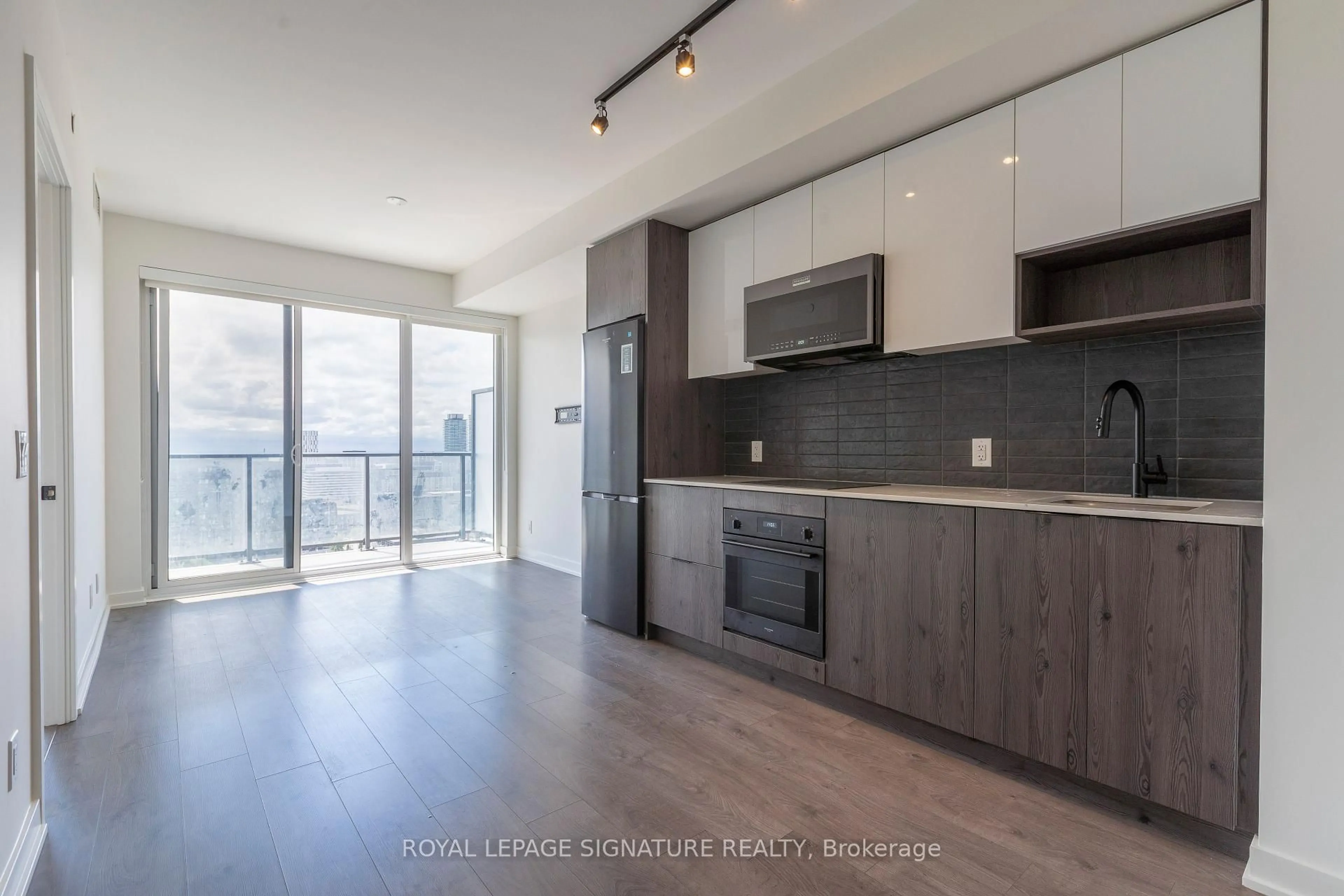 Open concept kitchen, wood/laminate floor for 5 Defries St #1804, Toronto Ontario M5A 0W7